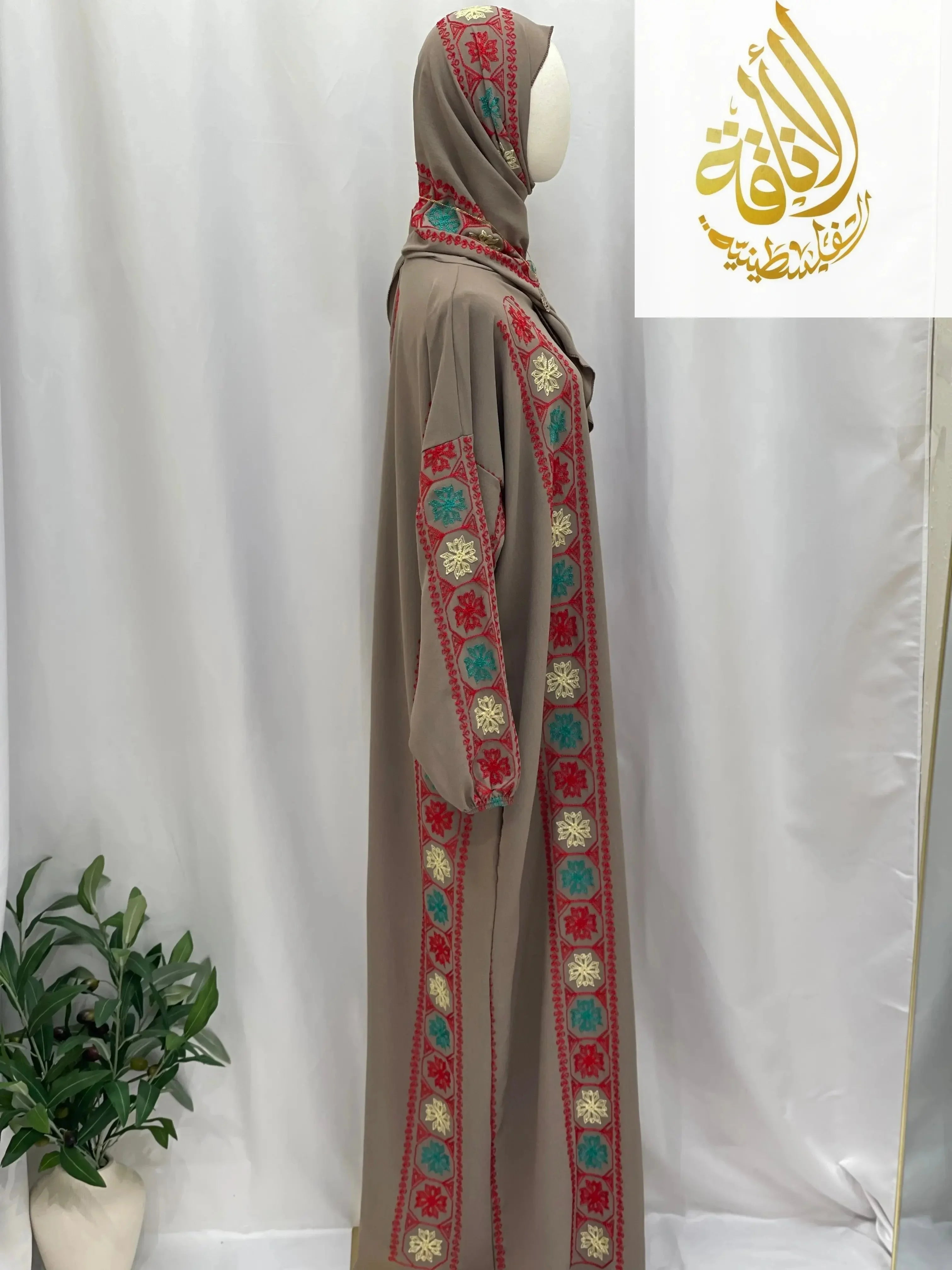 Palestinian Elegance embroidered prayer dress in beige with colorful traditional embroidery along the sleeves and front