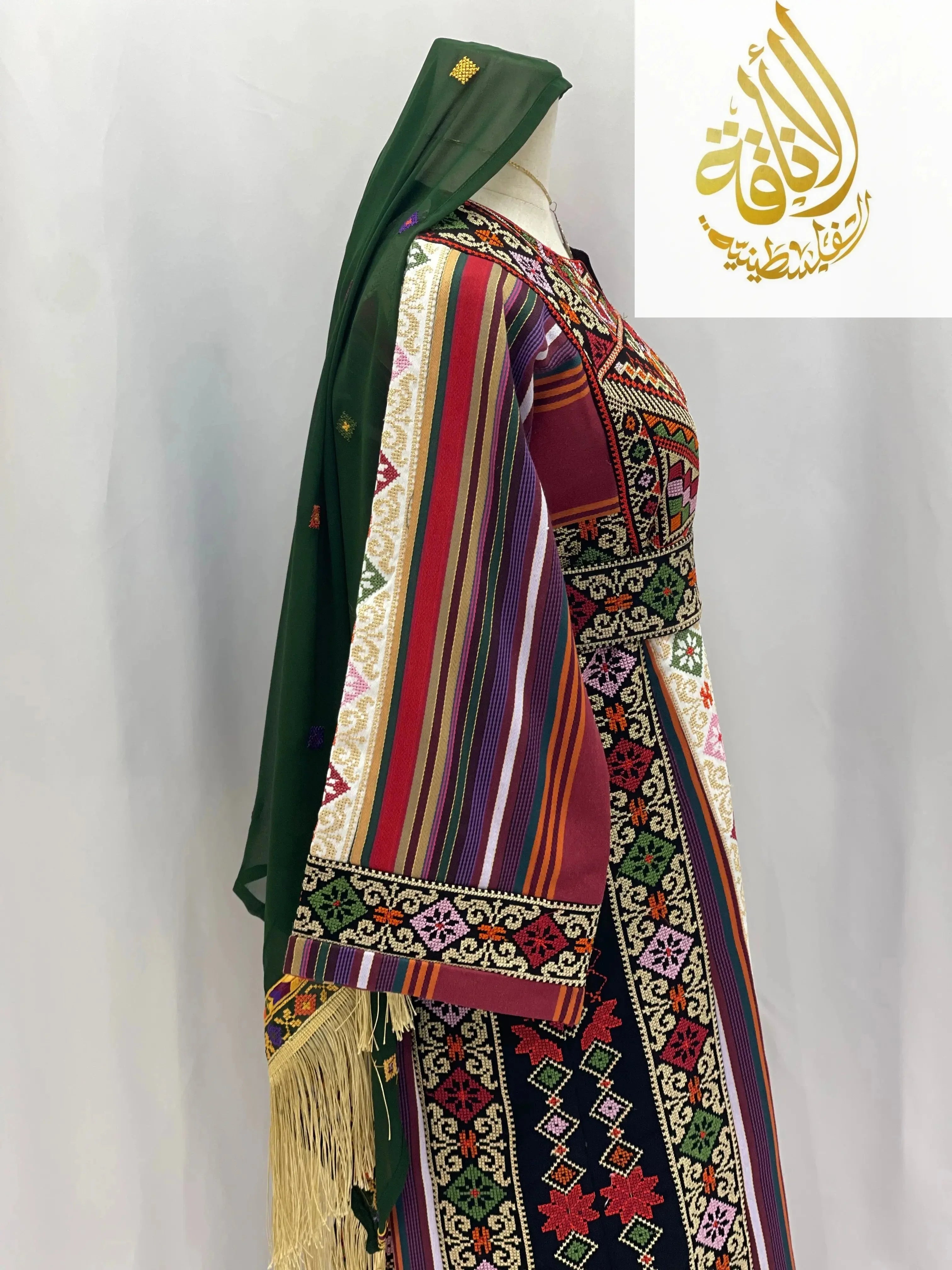Palestinian Elegance embroidered thoub for teens in multicolor with traditional patterns and green headscarf