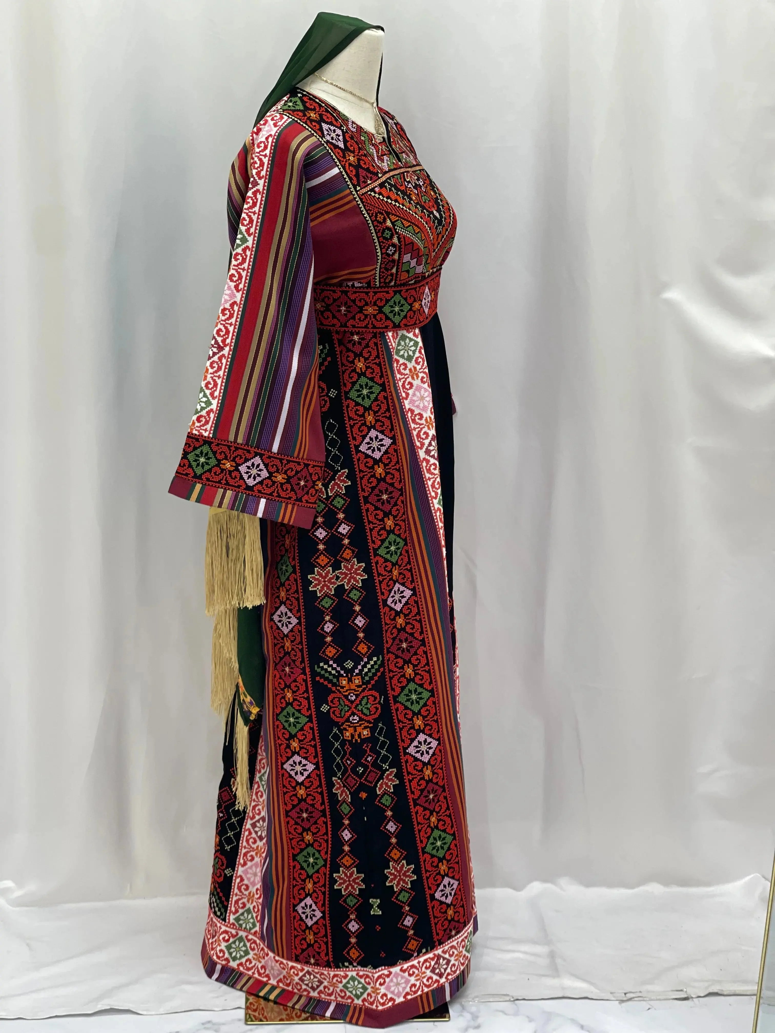 Palestinian Elegance embroidered thoub for teens with traditional colorful geometric patterns and long sleeves