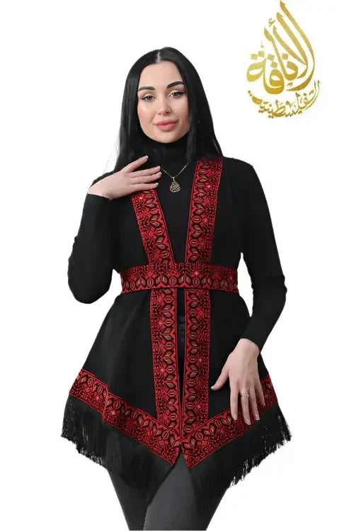 Woman wearing black embroidered shawl with red traditional Palestinian Elegance designs and fringed edges