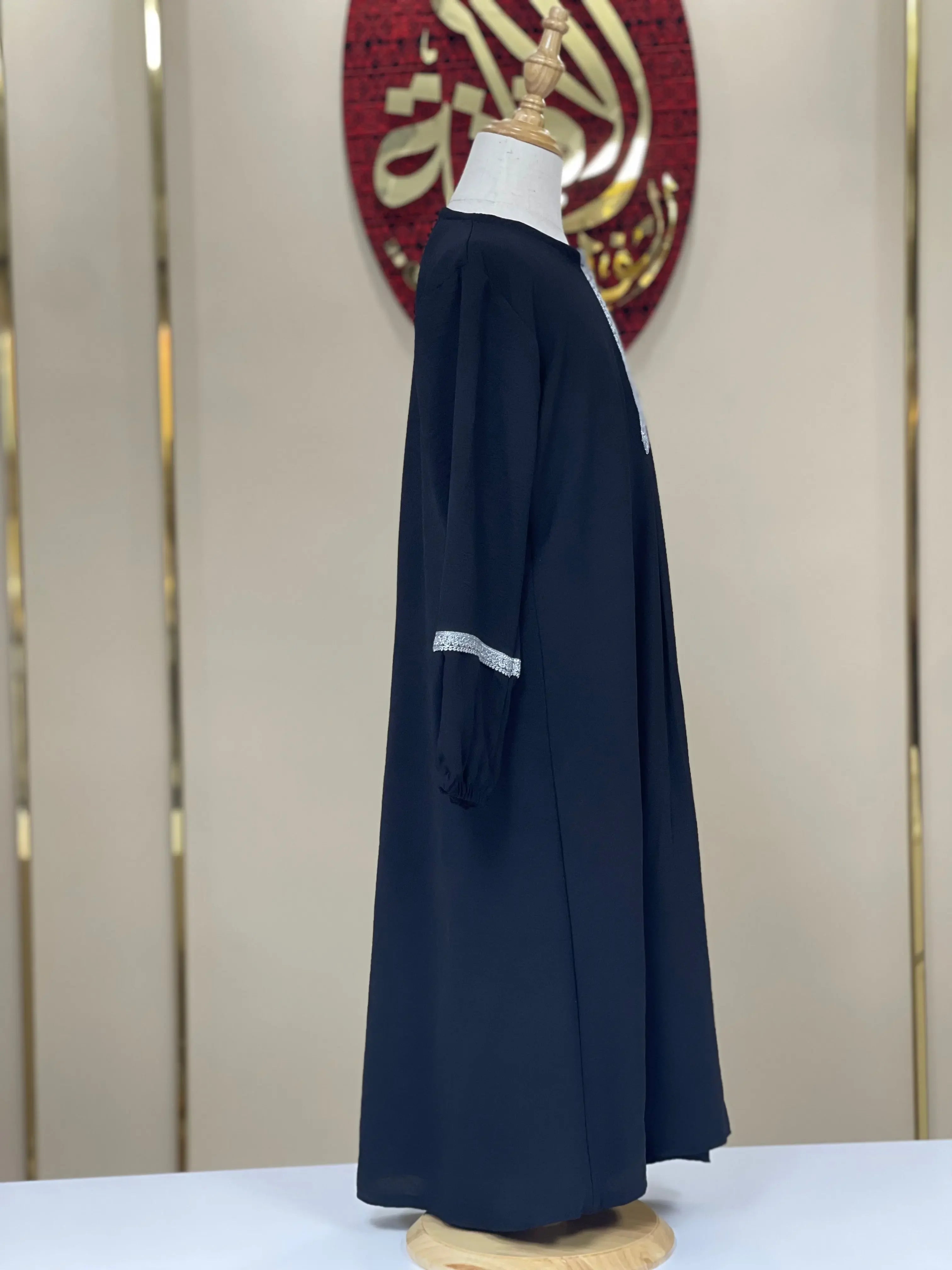 Palestinian Elegance girls embroidered abaya in navy blue with white embroidery detail on sleeves