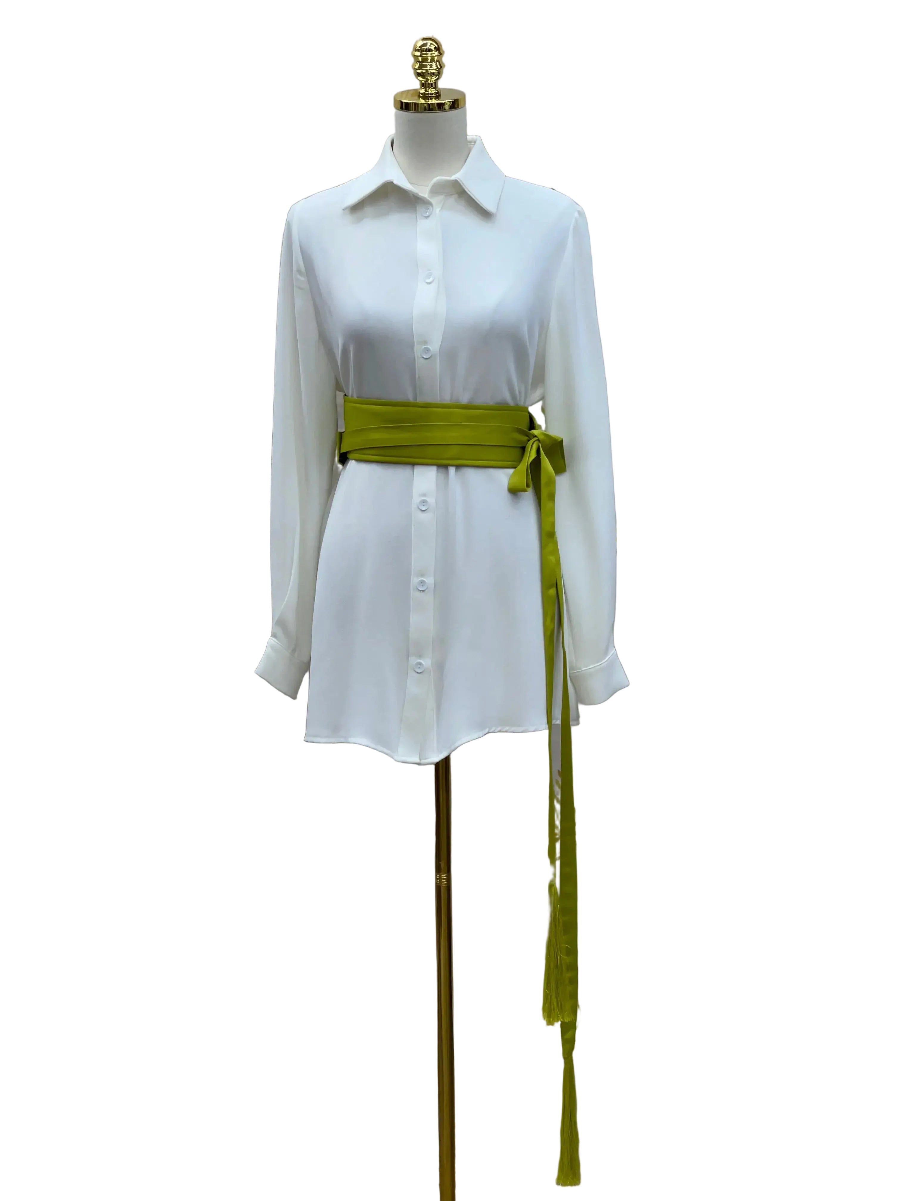 Luxury satin belt for dresses in olive green tied around white shirt dress on mannequin