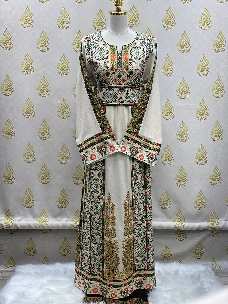 Embroidered Palestinian thobe with intricate colorful traditional patterns from Palestinian Elegance
