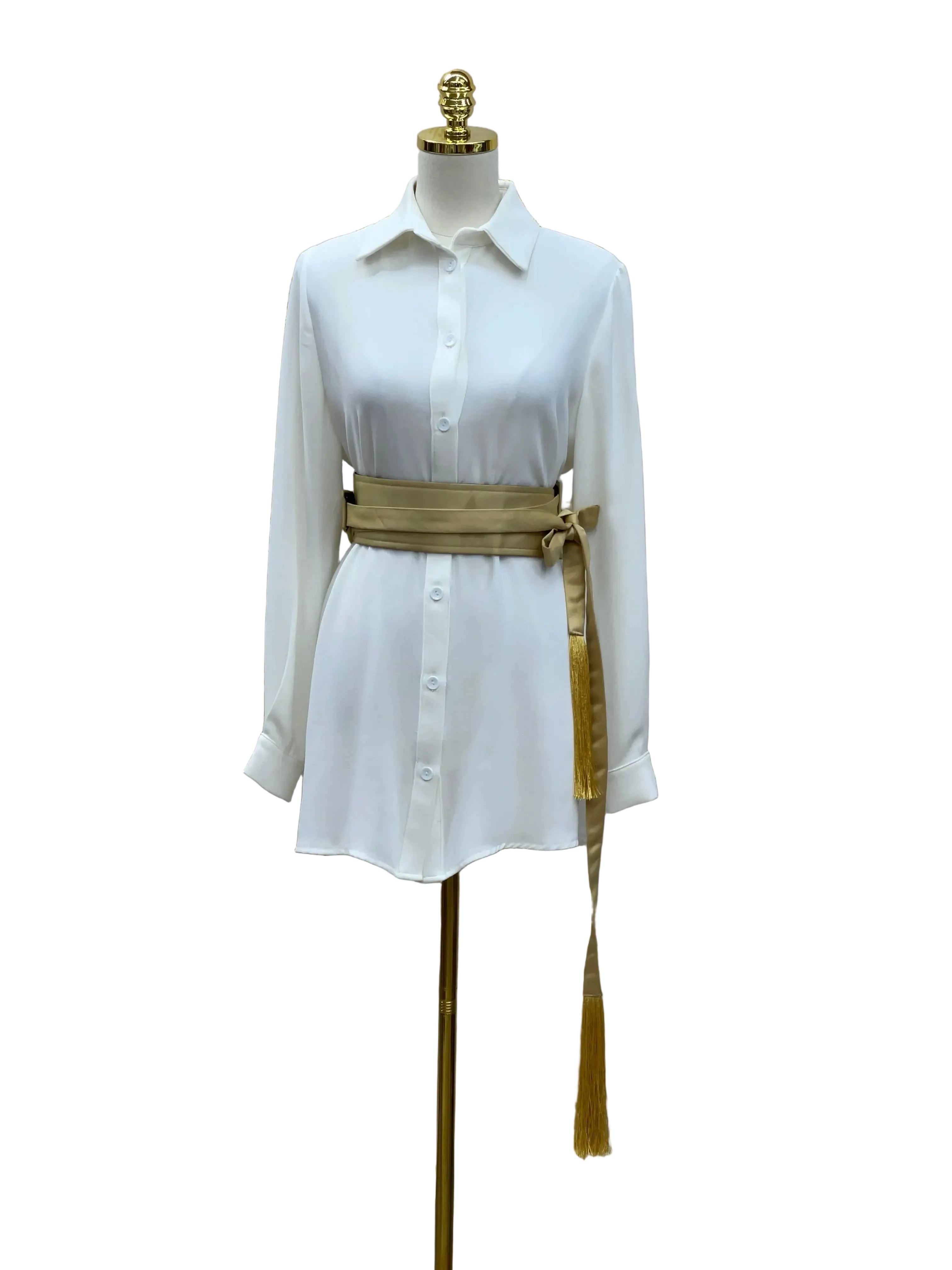 Luxury satin belt for dresses in gold tied around white button-up shirt on mannequin