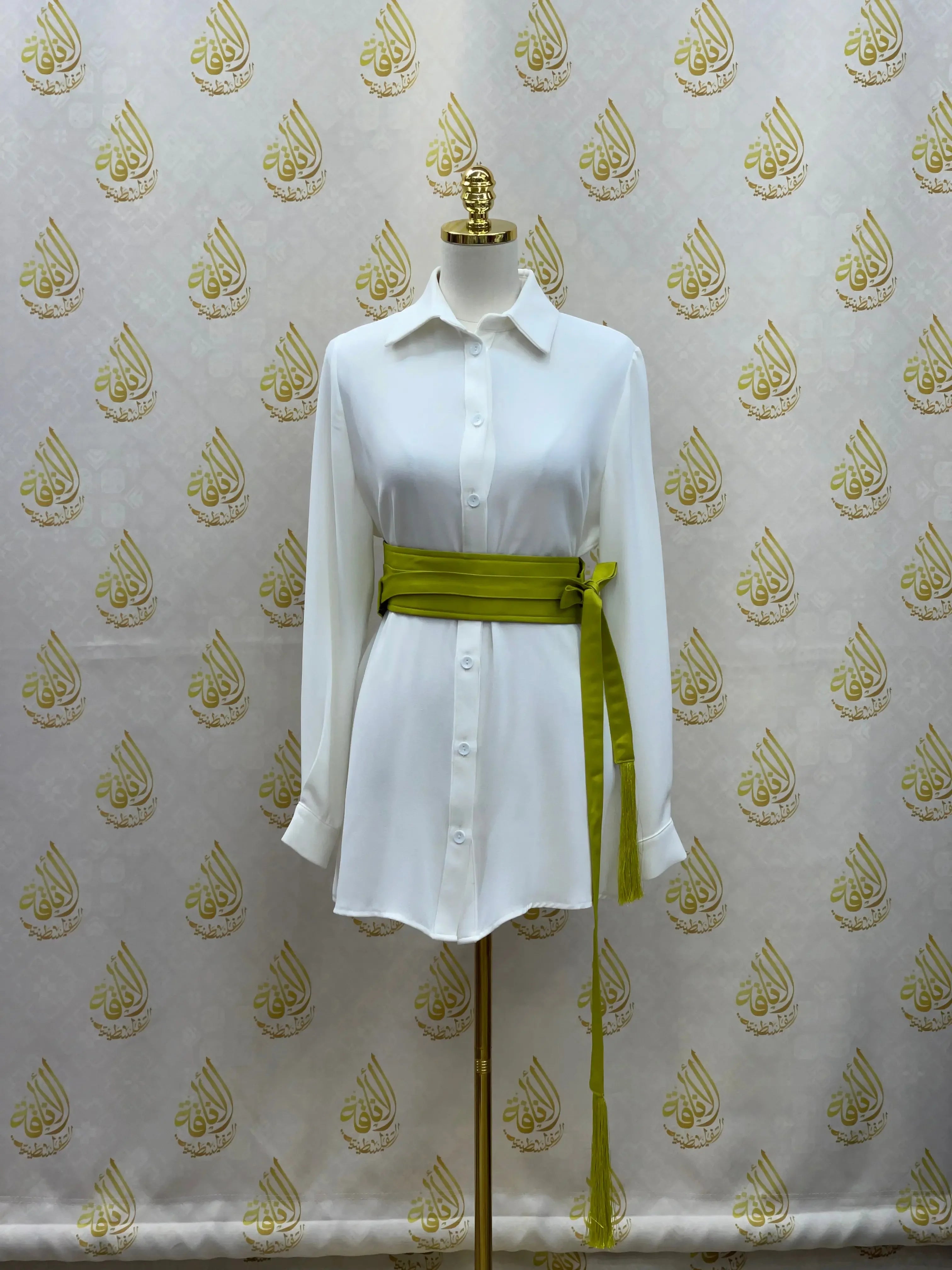 Green luxury satin belt for dresses styled on white button-down shirt by Palestinian Elegance