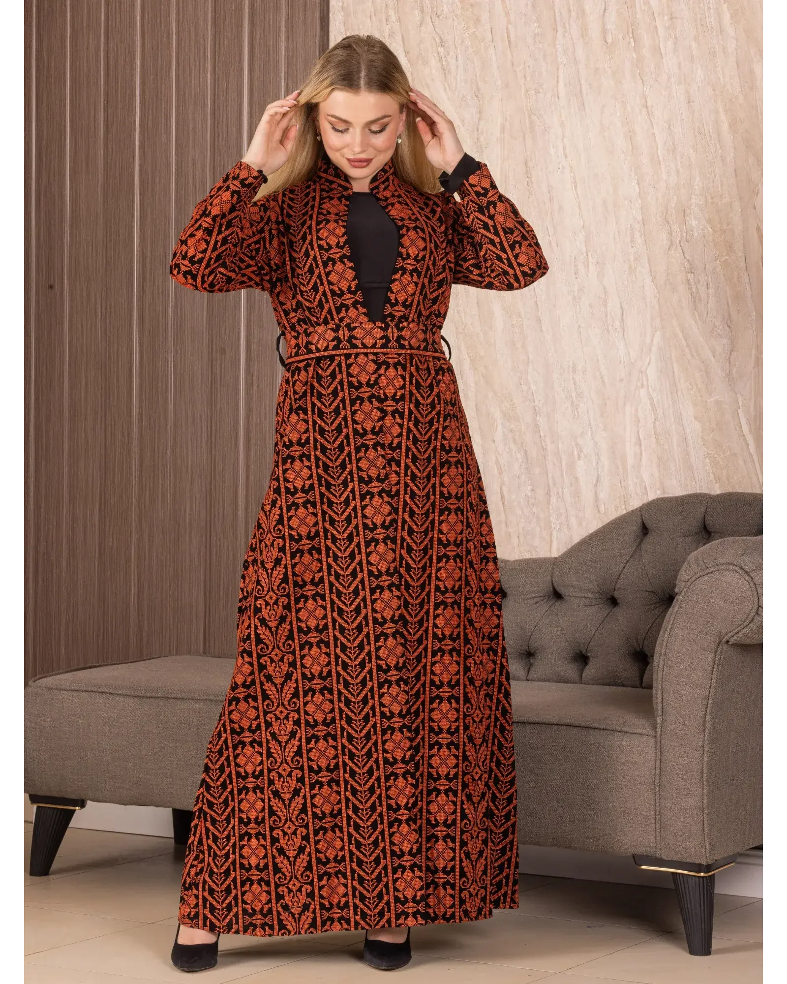 Palestinian Elegance embroidered long cardigan with intricate geometric patterns in black and rust colors