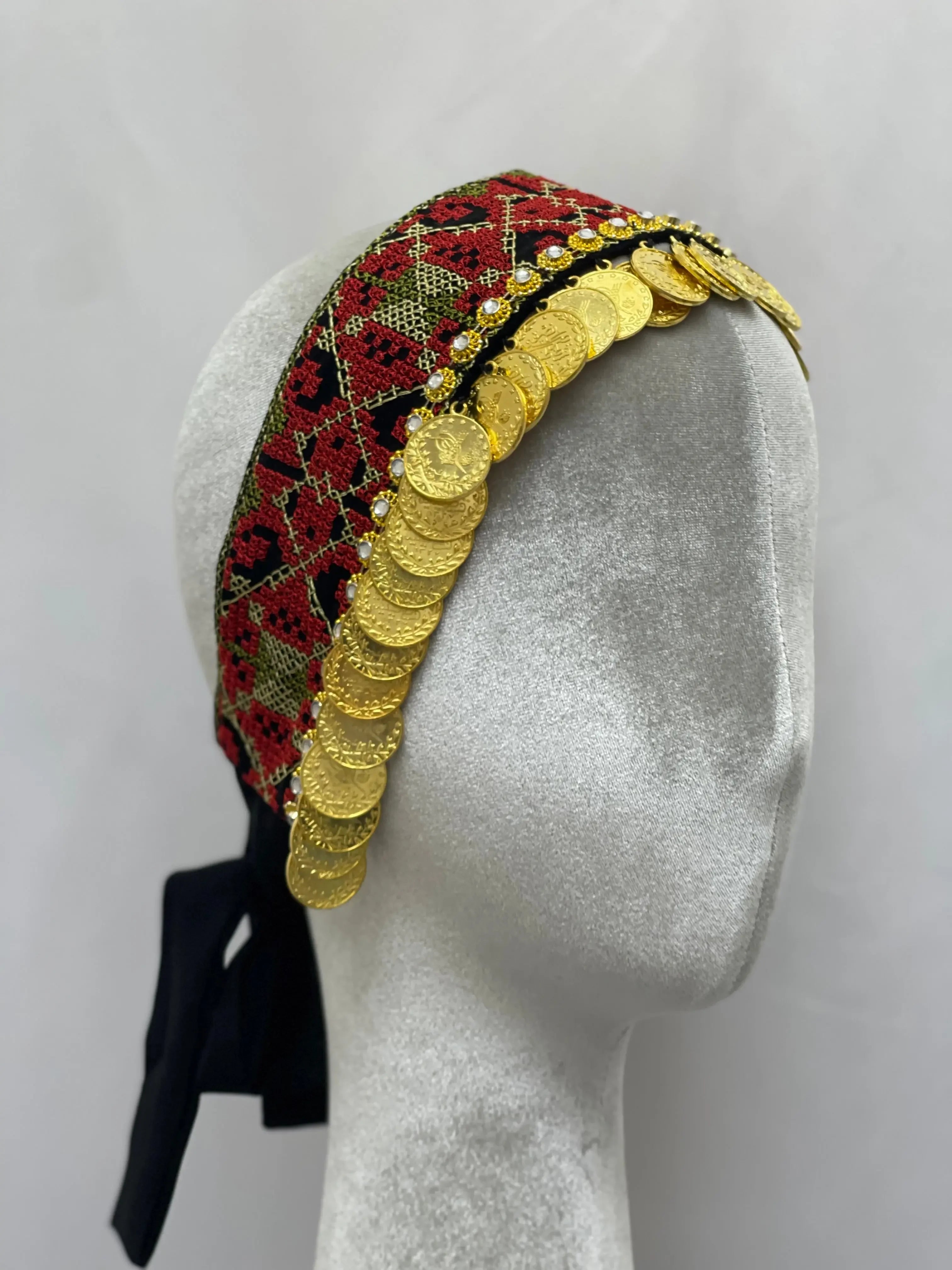 Palestinian Elegance tatreez head scarf with beads and gold coin embellishments on mannequin