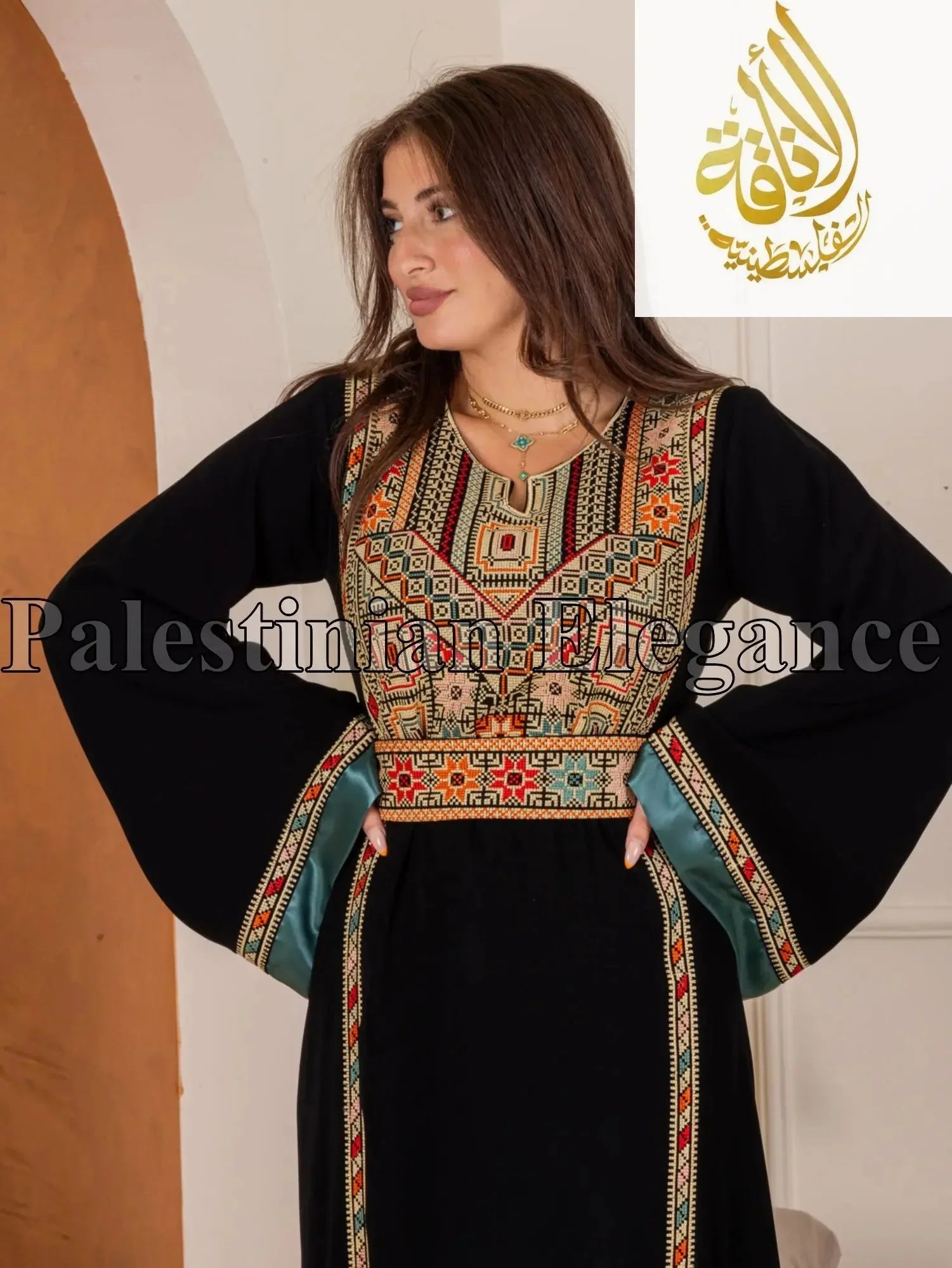Black Fadwa Embroidered Thoub with traditional colorful stitching and wide sleeves by Palestinian Elegance