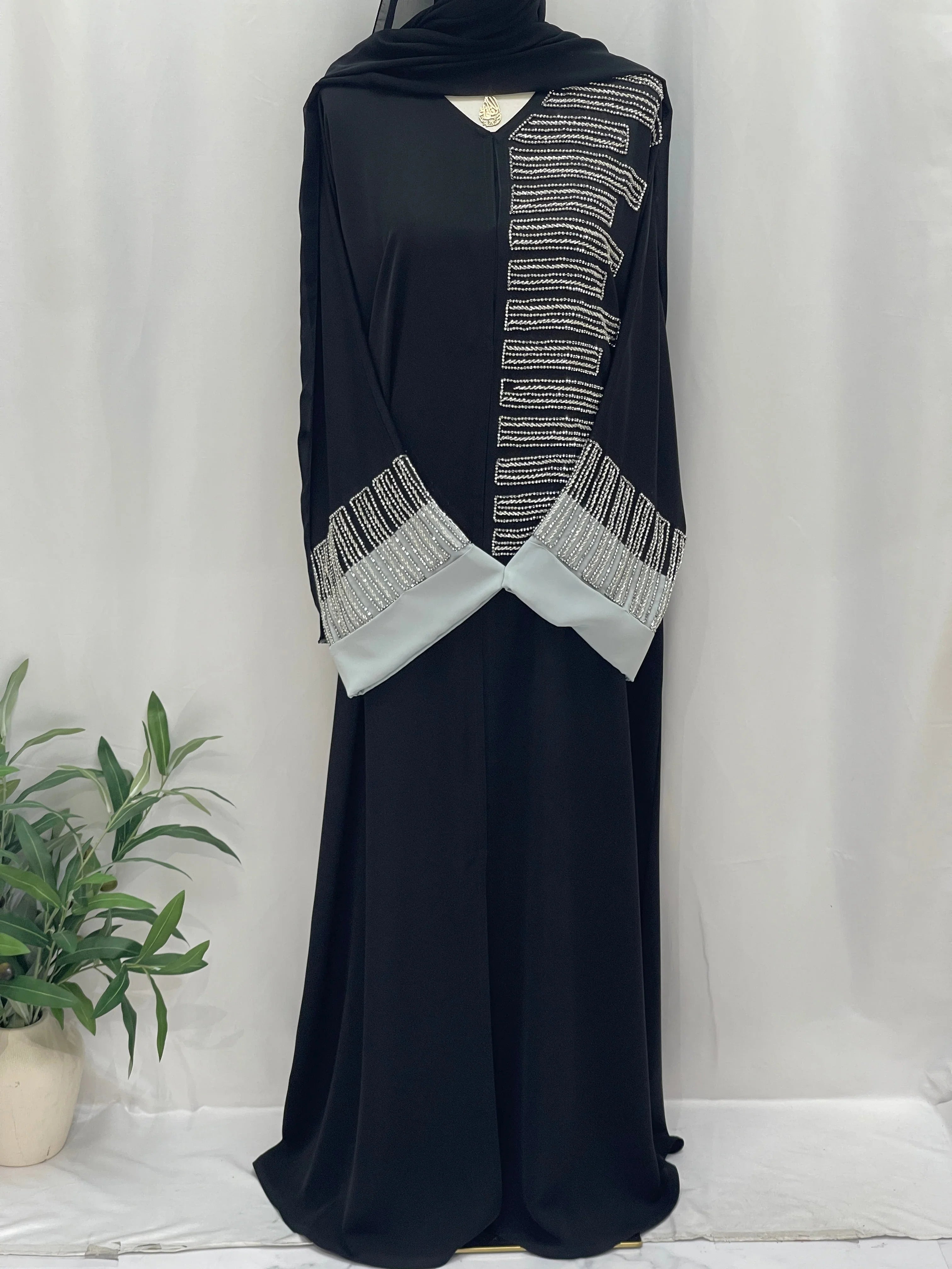 Palestinian Elegance black abaya with silver bead stripe detailing and light gray cuffs Fancy Beads Dubai Abaya