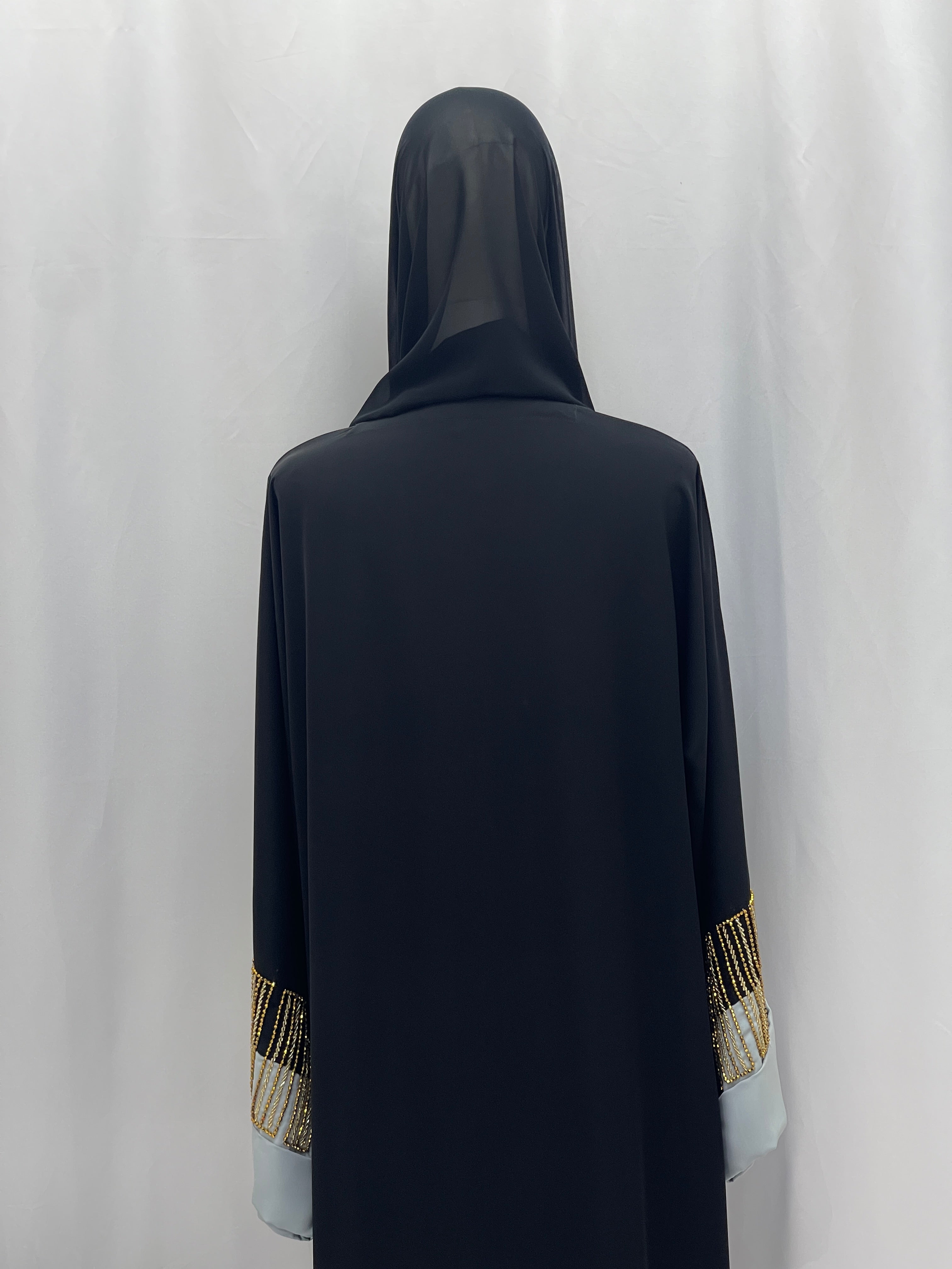 Palestinian Elegance black abaya back view with hood and gold beaded sleeve trim Fancy Beads Dubai Abaya