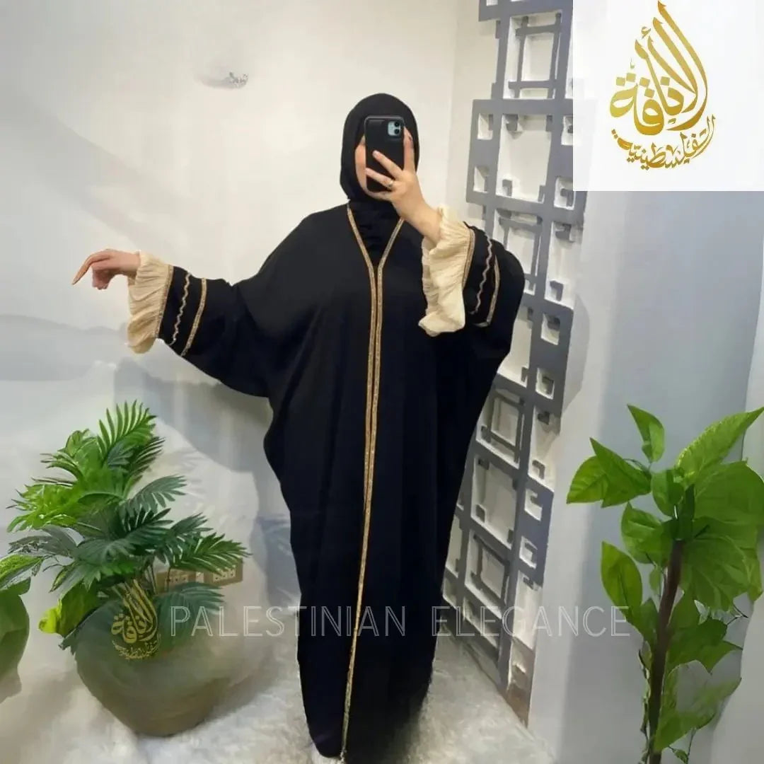 Free size black abaya with gold trim and beige ruffled sleeves from Palestinian Elegance