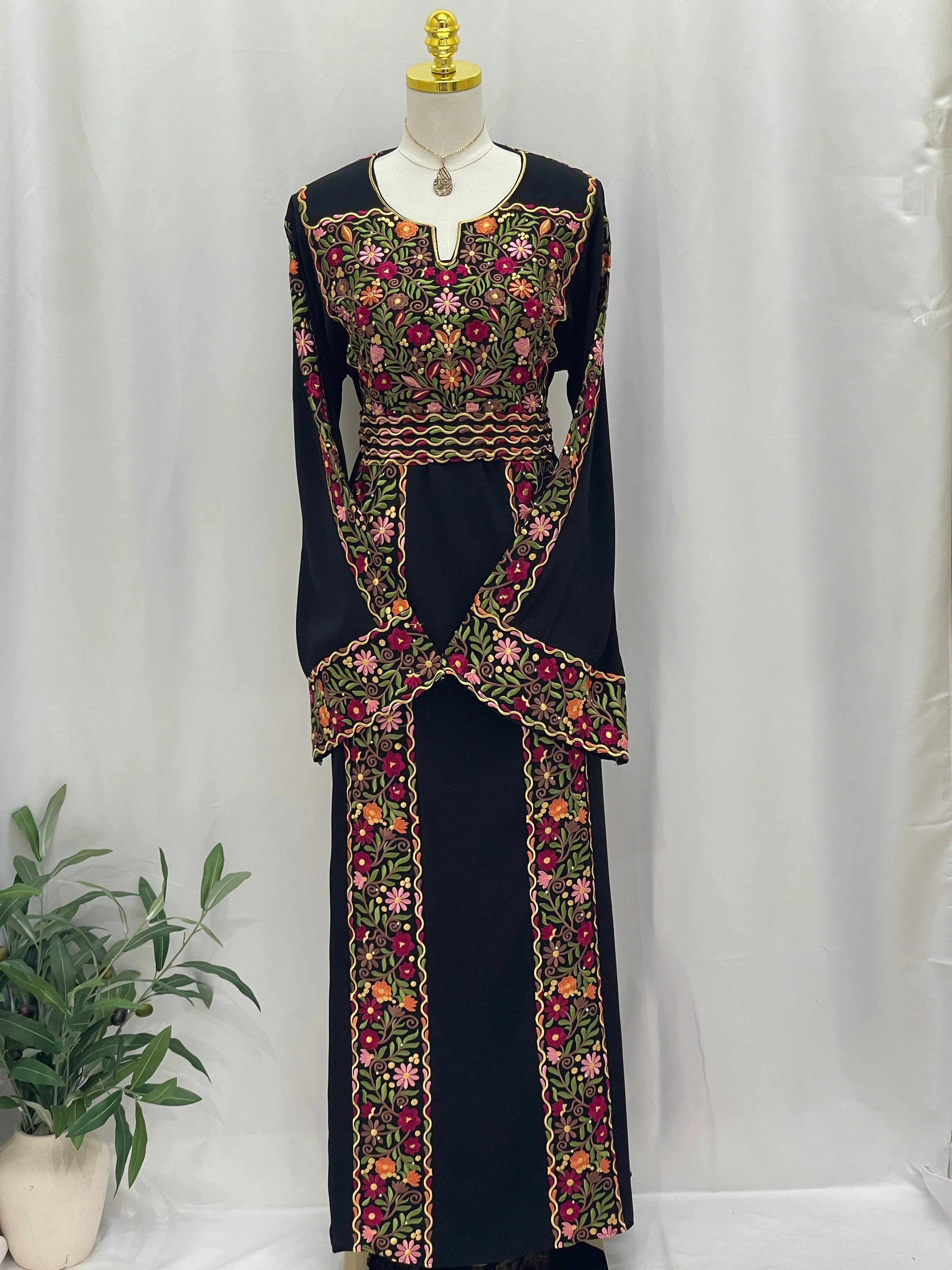 Floral Essence Embroidered Thobe featuring vibrant floral patterns and traditional design elements