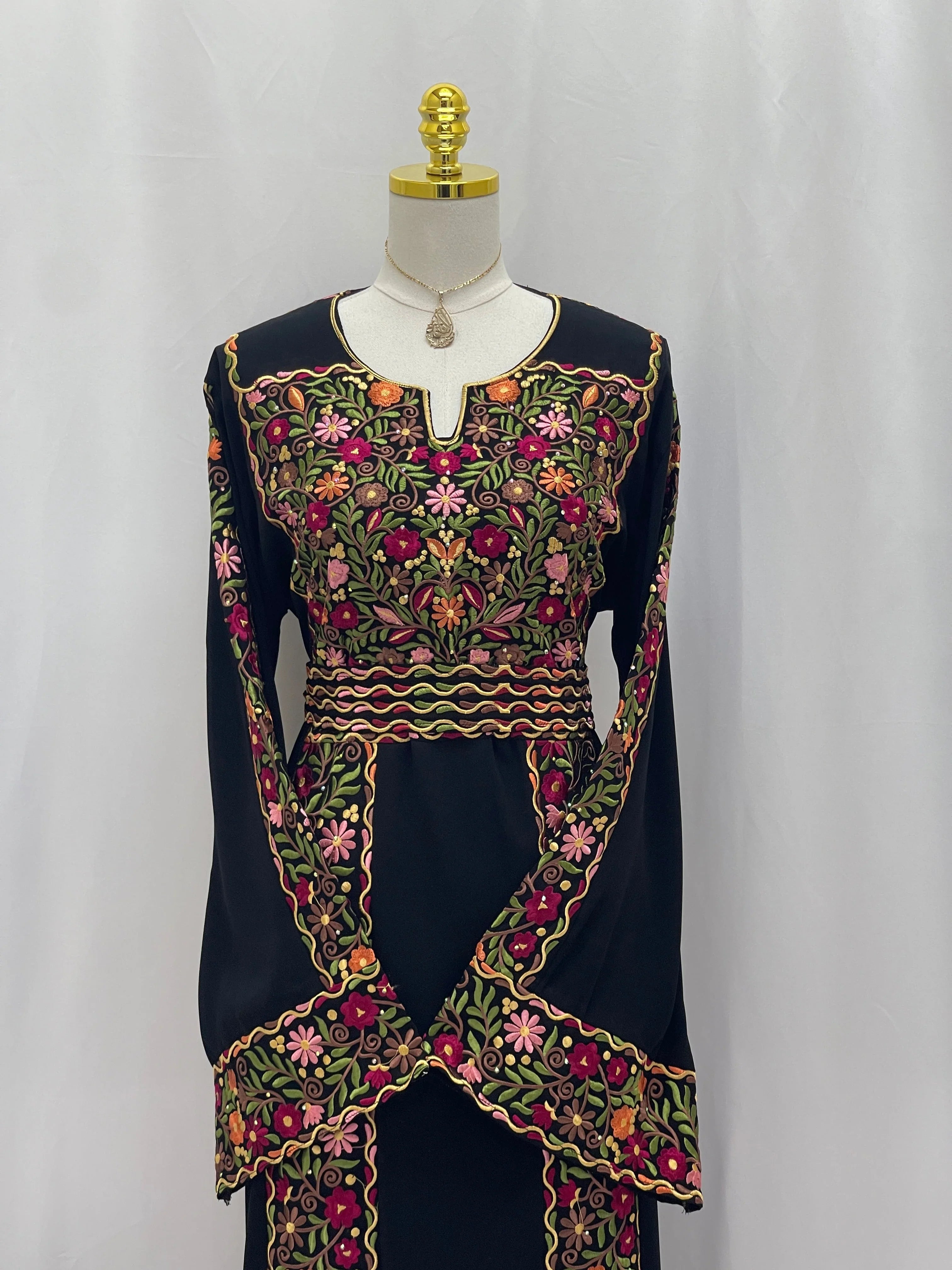 Floral Essence Embroidered Thobe featuring vibrant floral designs and elegant long sleeves