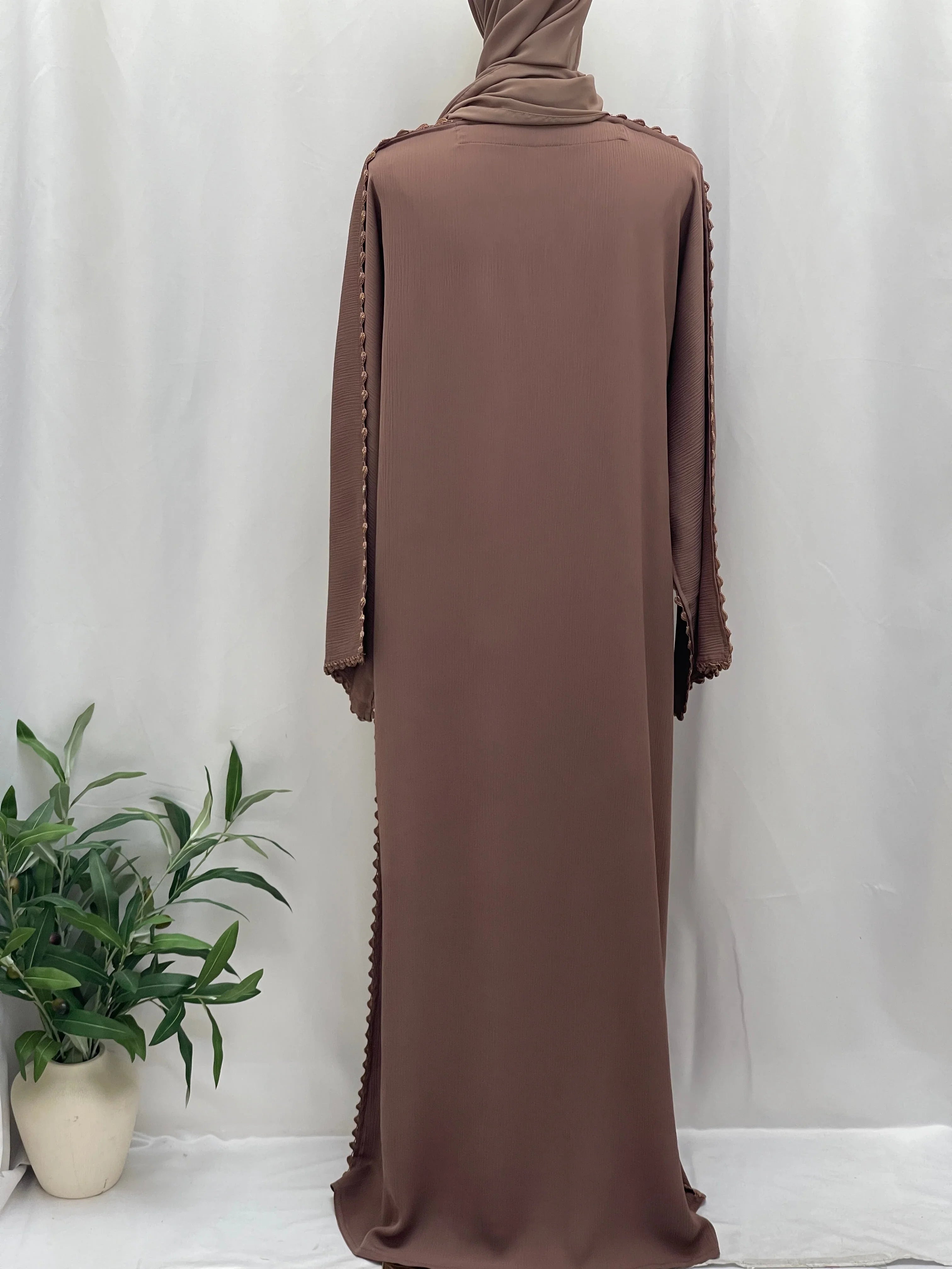 Back view of Palestinian Elegance Ghosoon Abaya in brown with decorative edging and long sleeves
