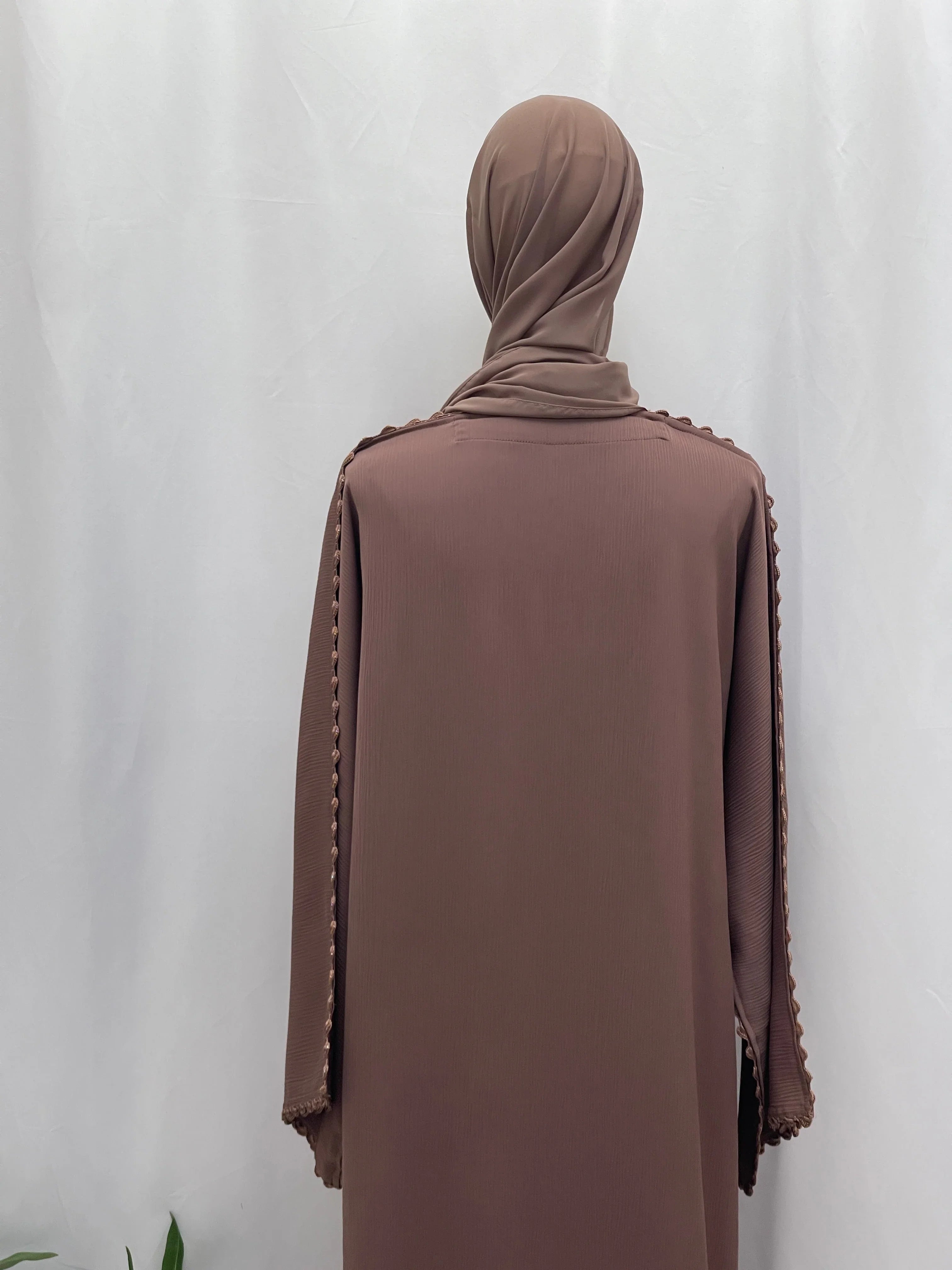 Back view of Palestinian Elegance Ghosoon Abaya in brown with detailed trim on sleeves and matching hijab