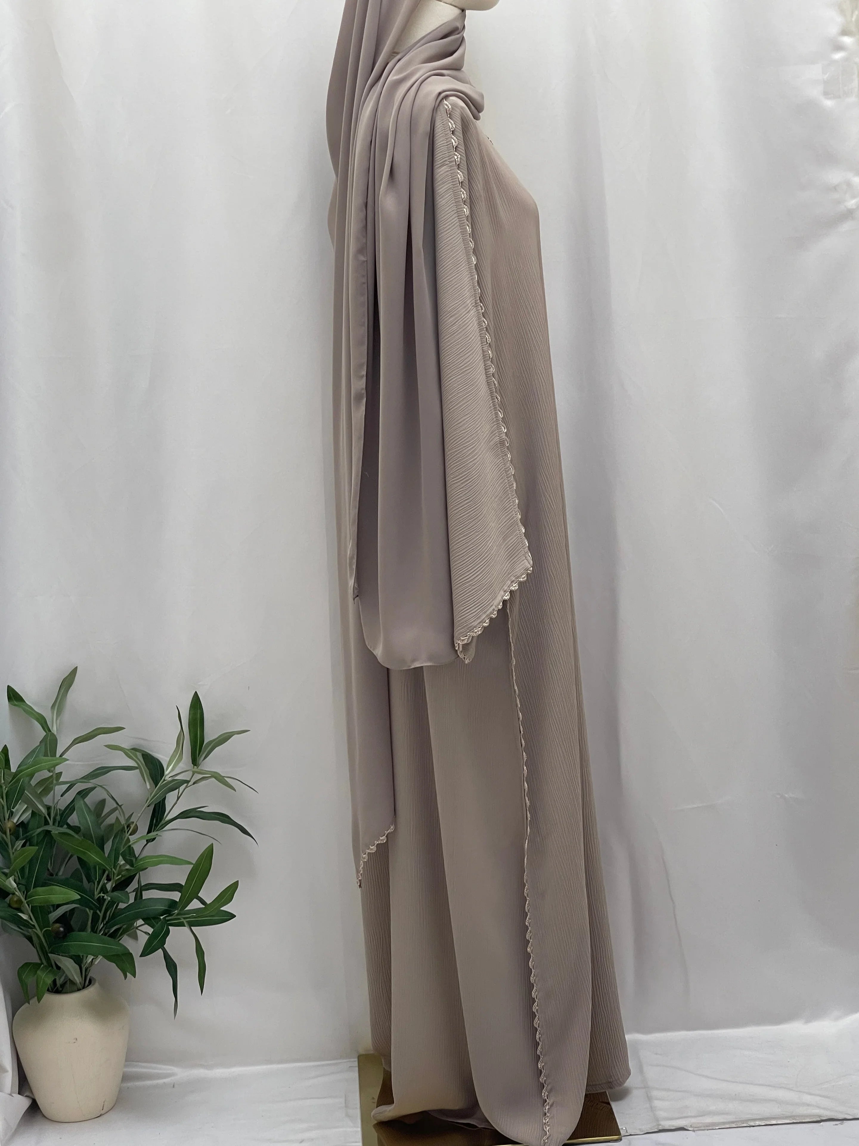 Palestinian Elegance Ghosoon Abaya in soft taupe with detailed edging on sleeves and flowing fabric
