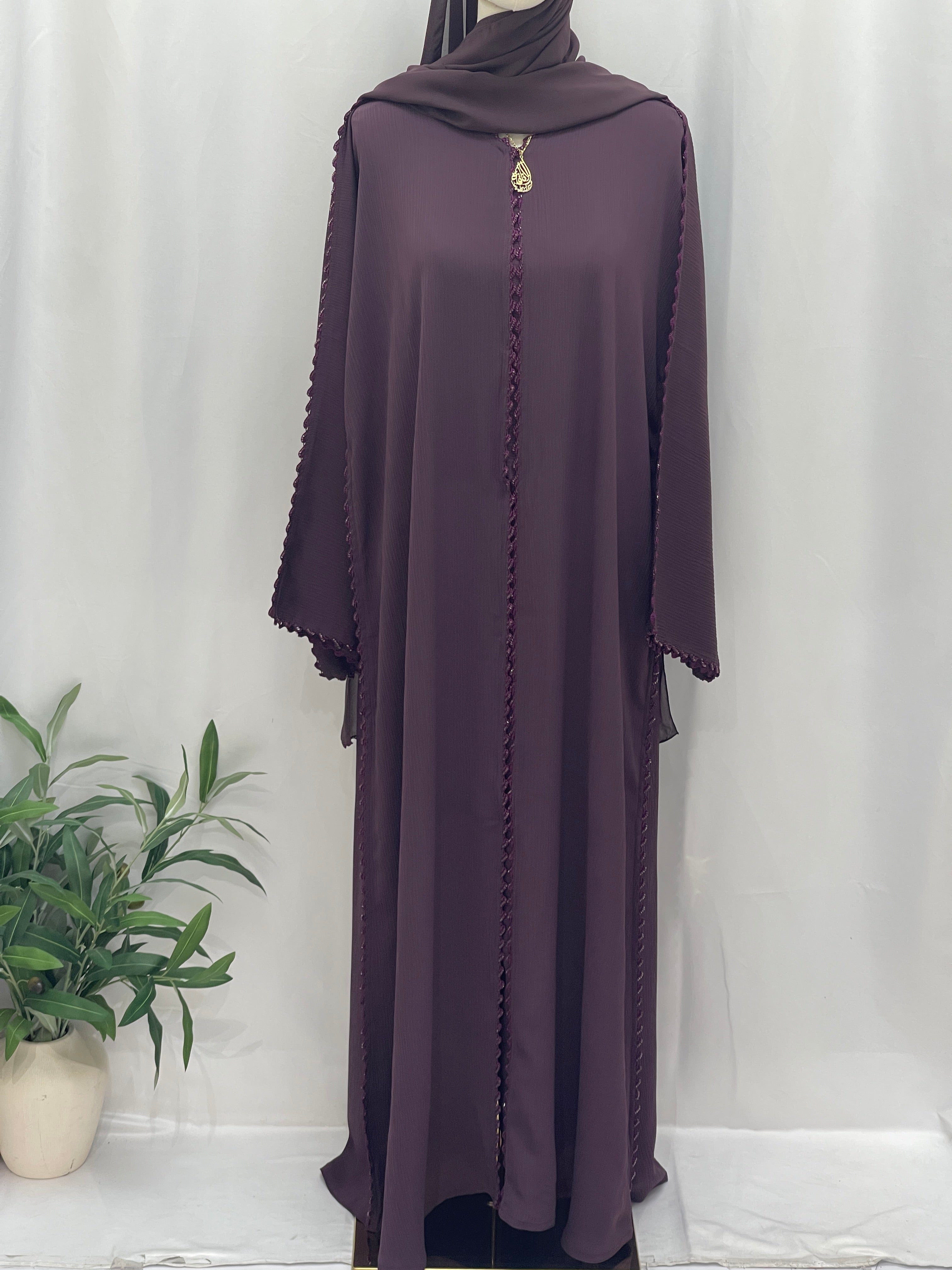 Palestinian Elegance Ghosoon Abaya in deep purple with braided edge detail and loose fit design