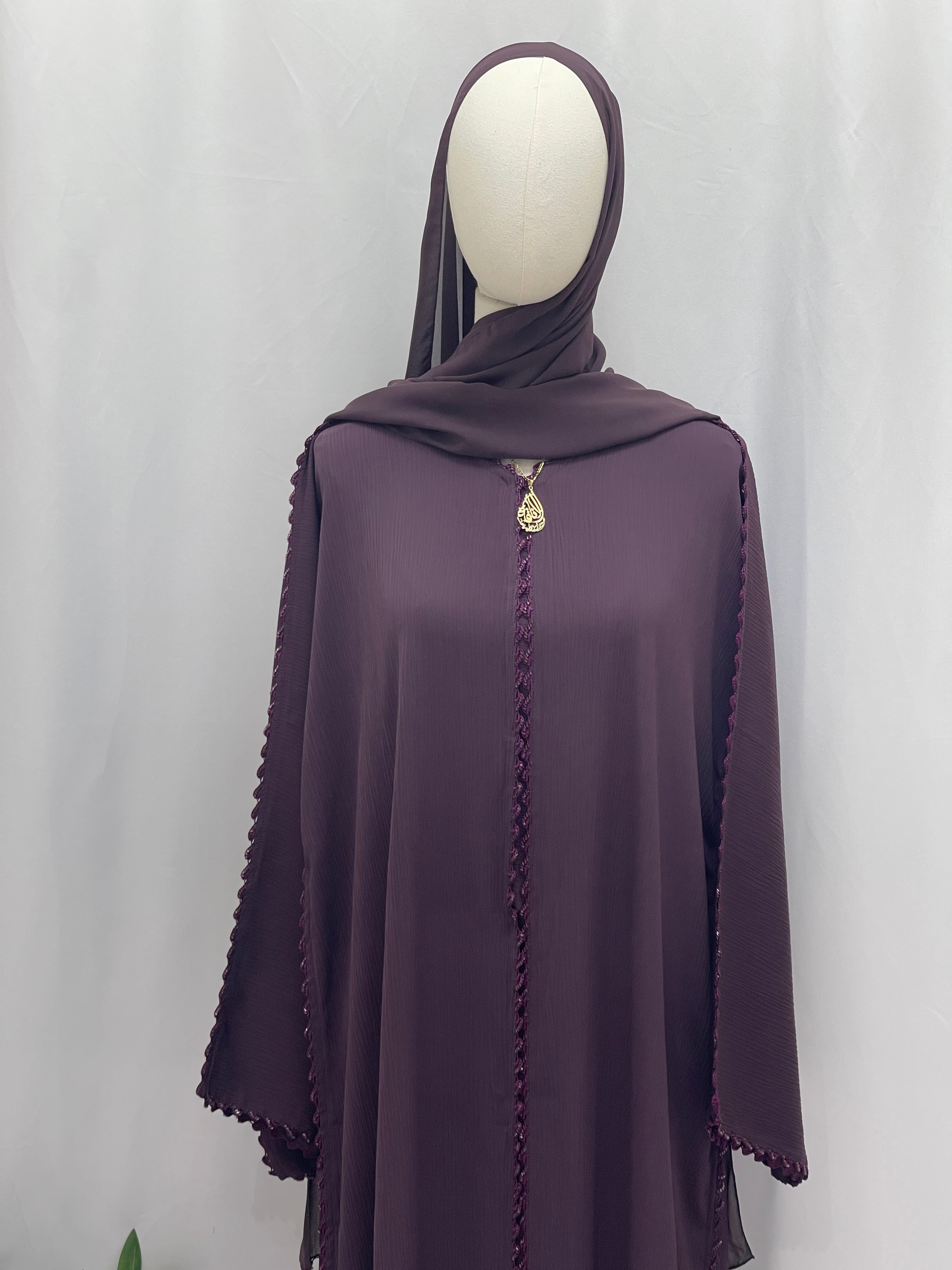 Palestinian Elegance Ghosoon Abaya in deep purple with detailed trim and matching hijab