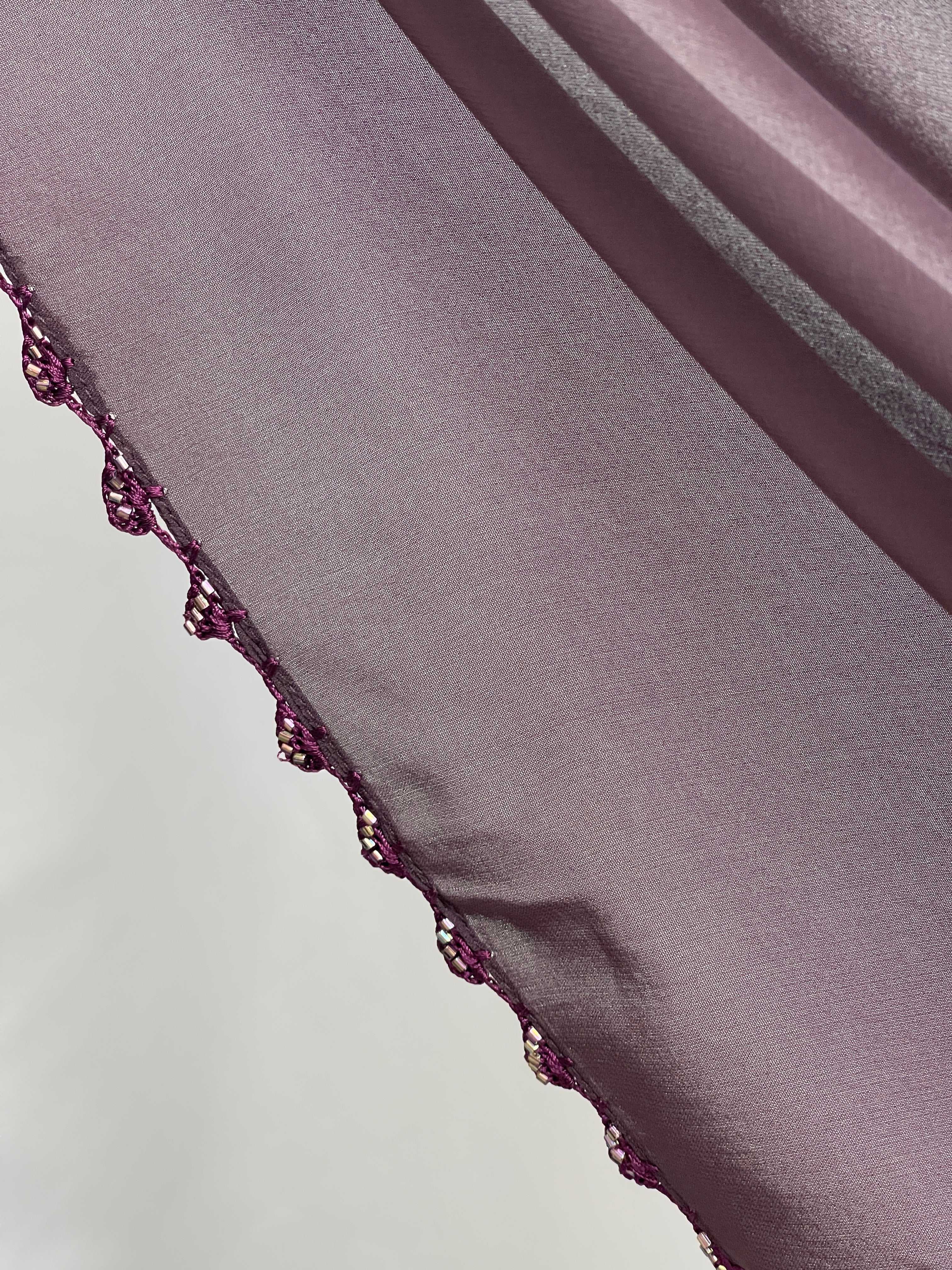Palestinian Elegance Ghosoon Abaya in deep purple turban edge embroidery close detail