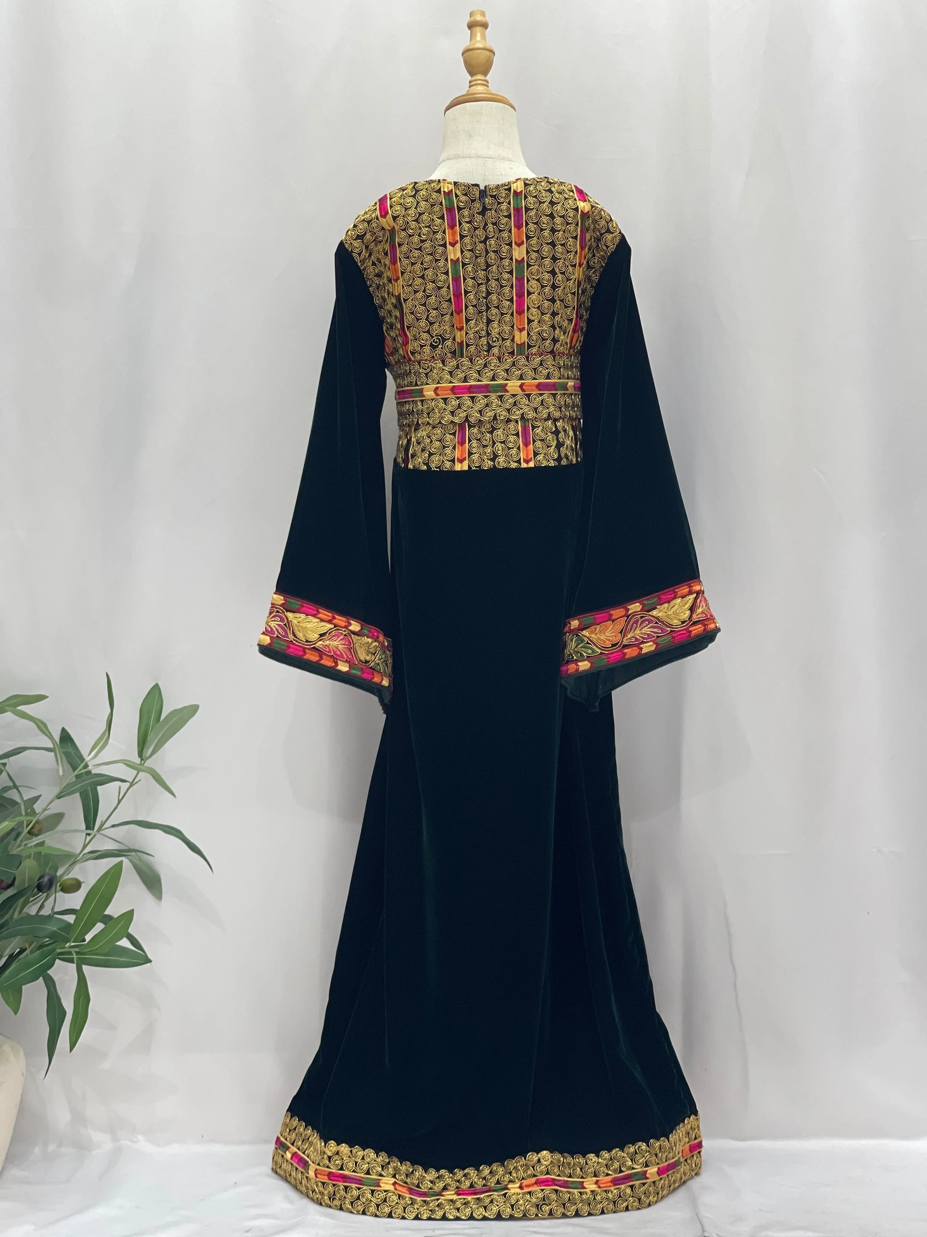Emerald Velvet Embroidered Qasab Thobe with intricate floral designs and flowing sleeves