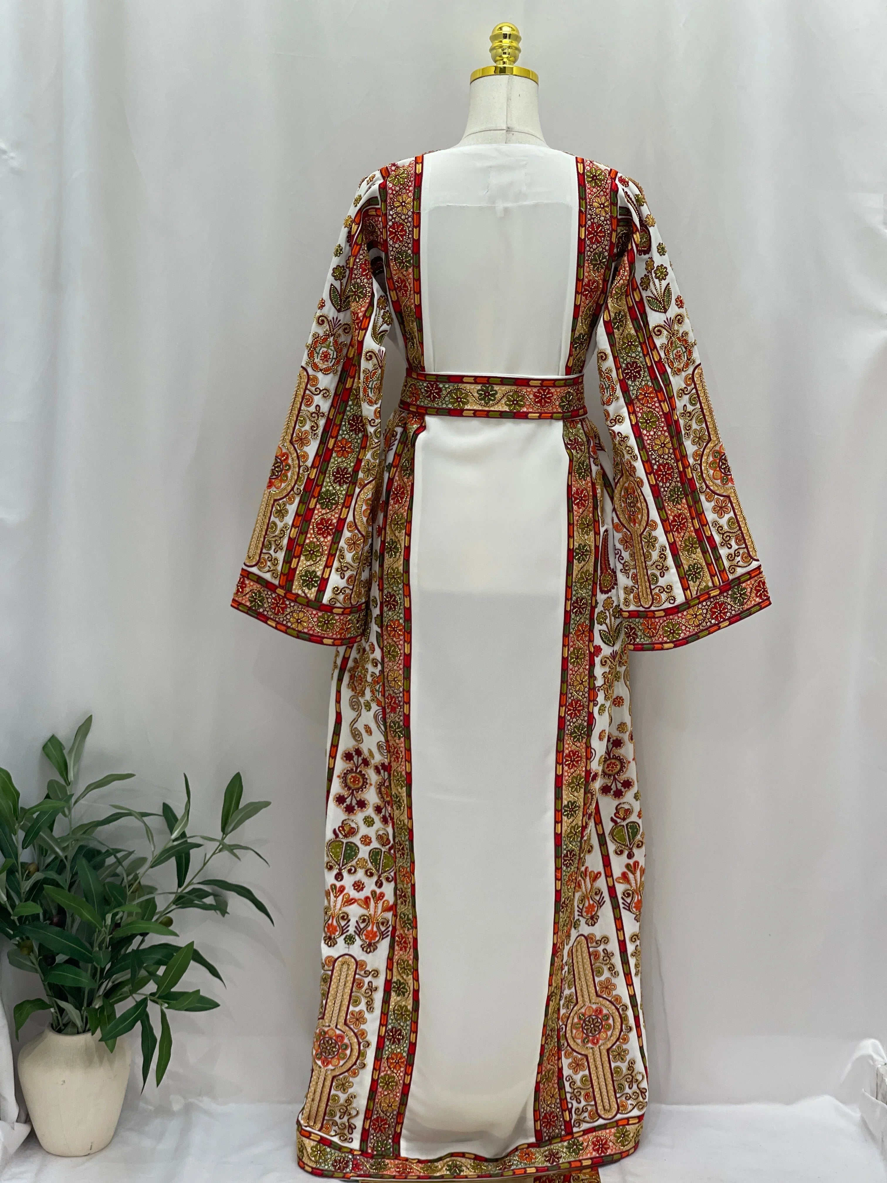 Palestinian Elegance Golden Blossom Beaded Embroidered Thobe white back view with gold red floral trim and belt