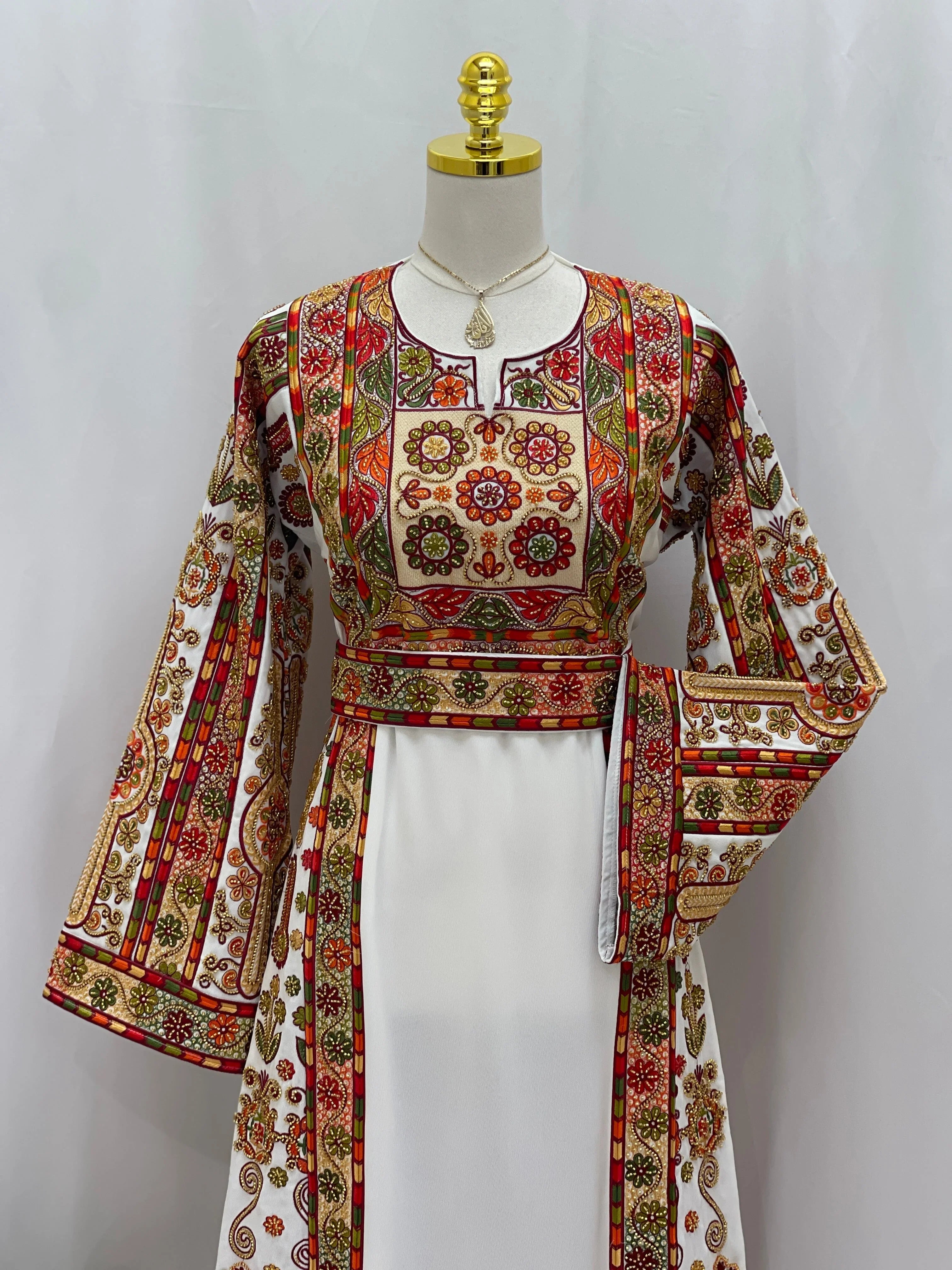 Golden Blossom Beaded Embroidered Thobe by Palestinian Elegance white dress with red gold floral panels and bell sleeves