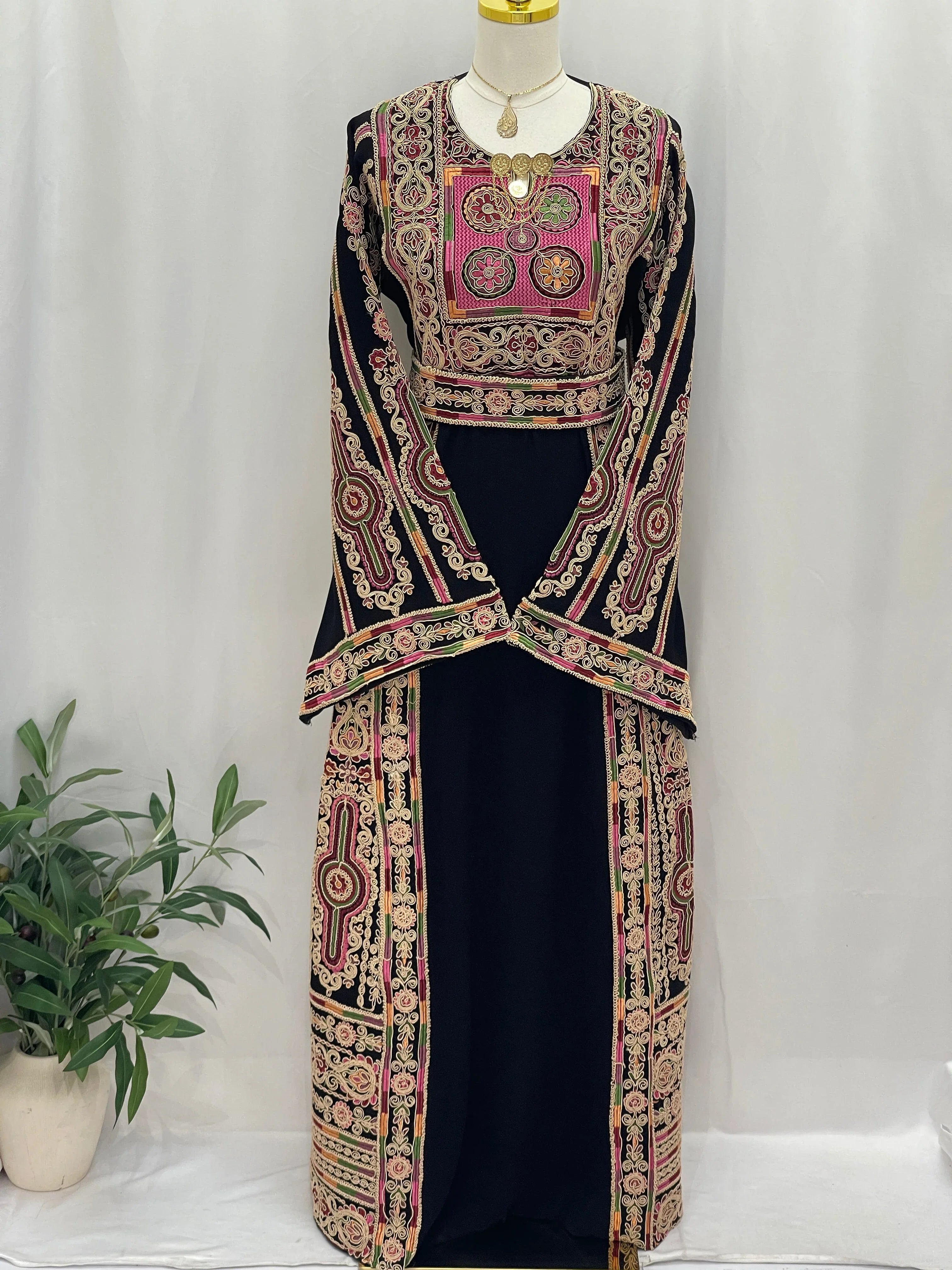 Golden Thread Embroidered Thobe by Palestinian Elegance black traditional long thobe with intricate gold and pink embroidery