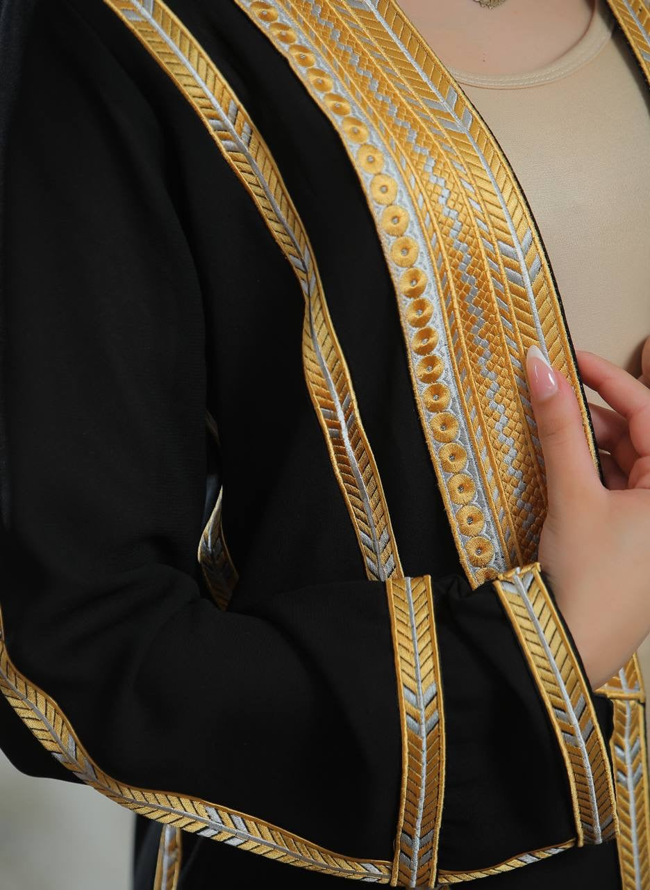 Palestinian Elegance Golden Touch Open Abaya black cardigan with intricate gold embroidered trim and model hand