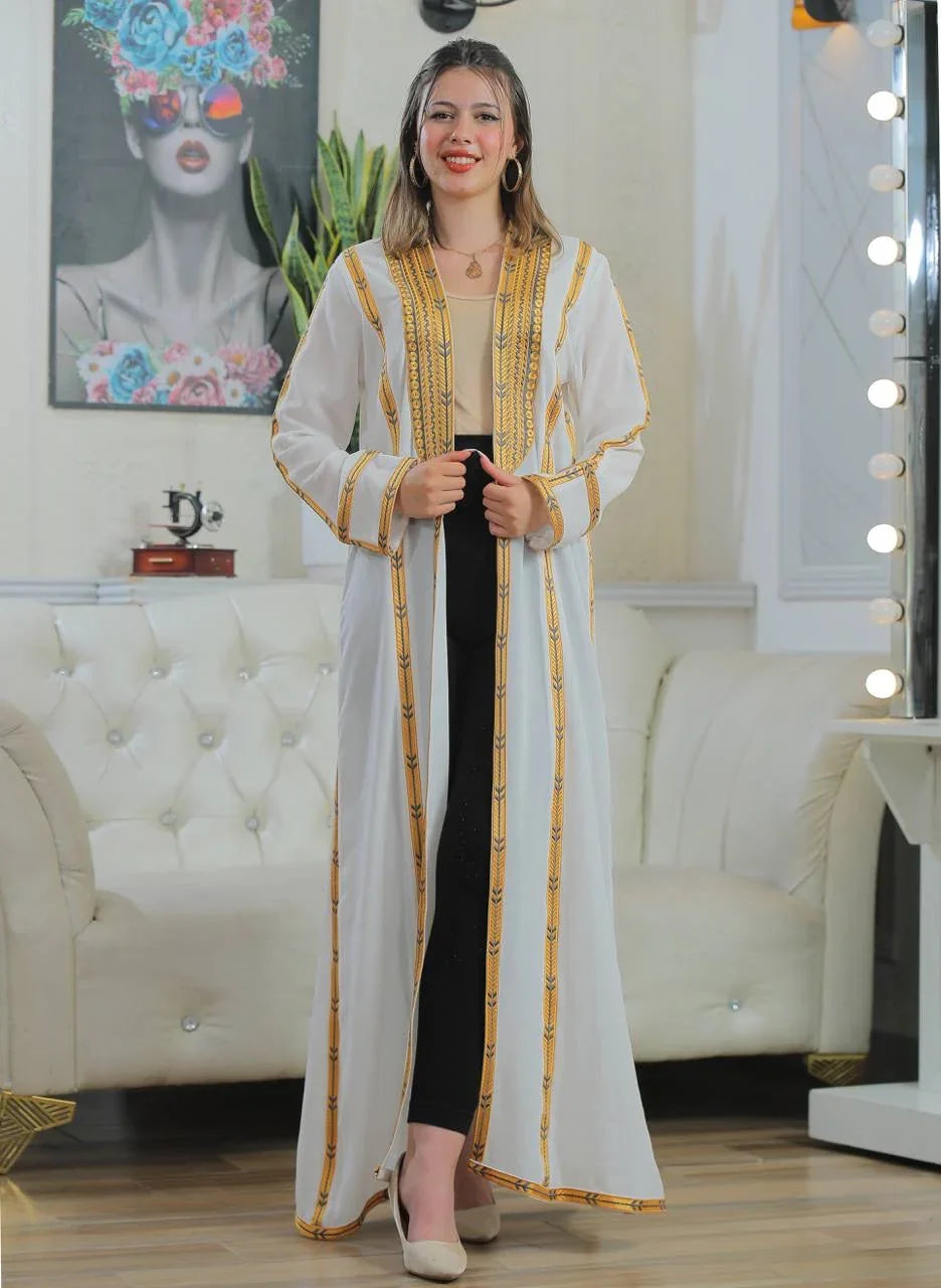 Golden Touch Open Abaya cardigan by Palestinian Elegance white long open front embroidered gold trim model wearing black pants