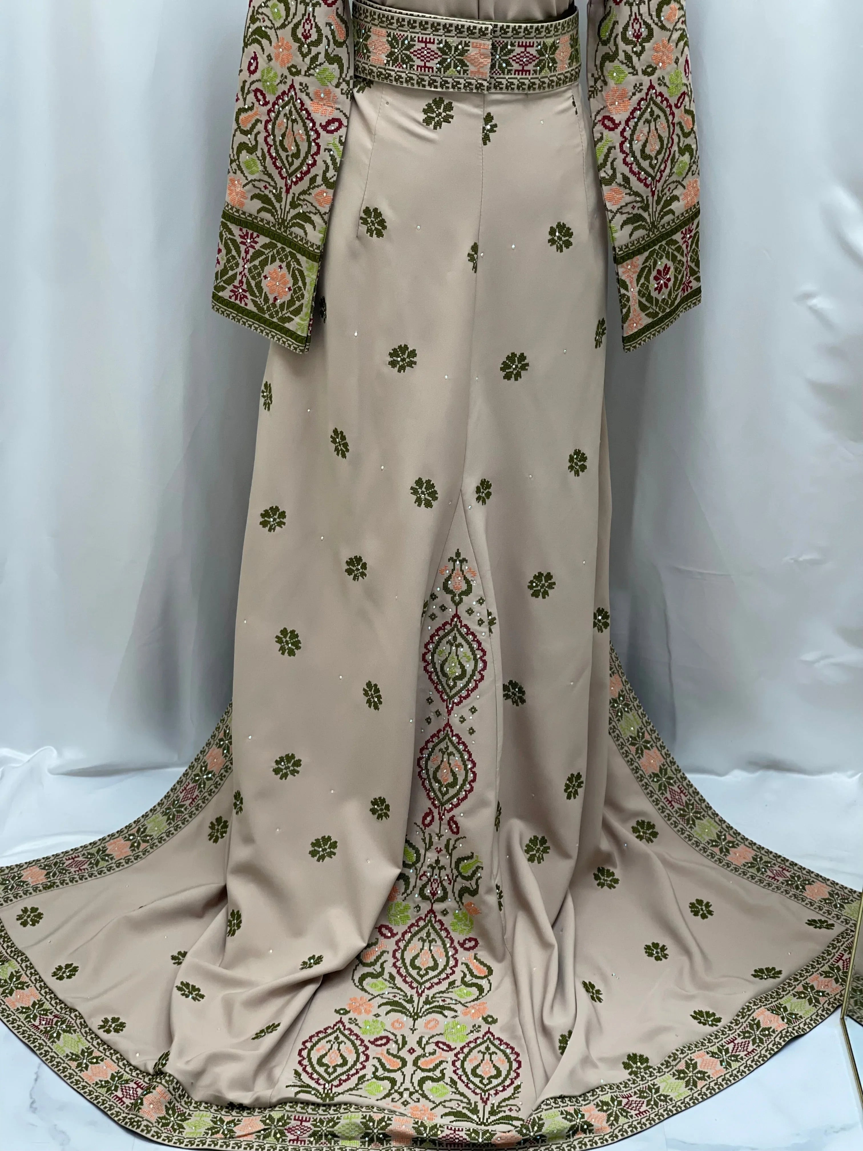 Elegant green ruby embroidered thobe with intricate floral designs and a flowing silhouette