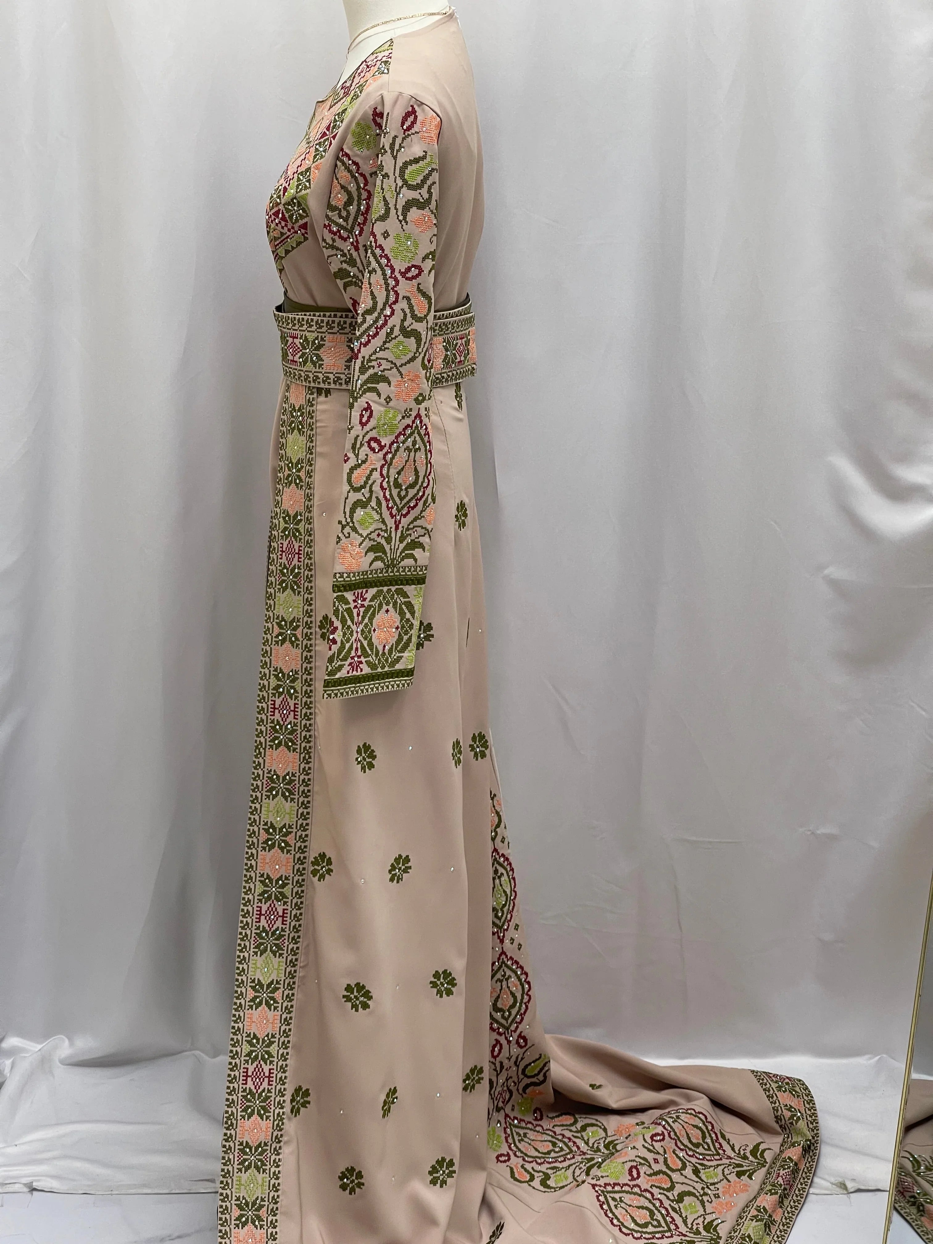 Side view of Green Ruby Embroidered Thobe featuring intricate floral designs and elegant details