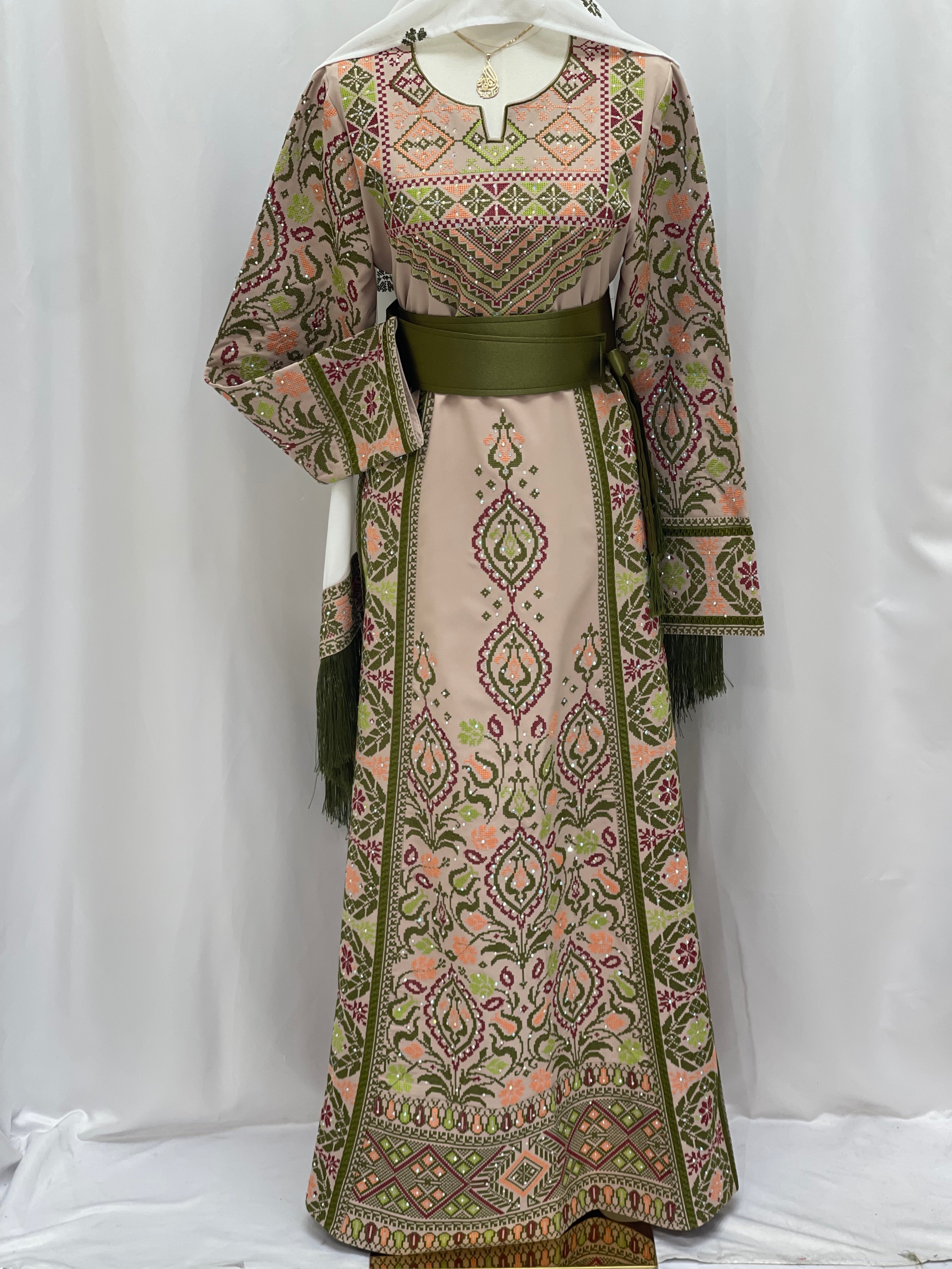 Green Ruby Embroidered Thobe with intricate floral patterns and a matching belt for elegant style