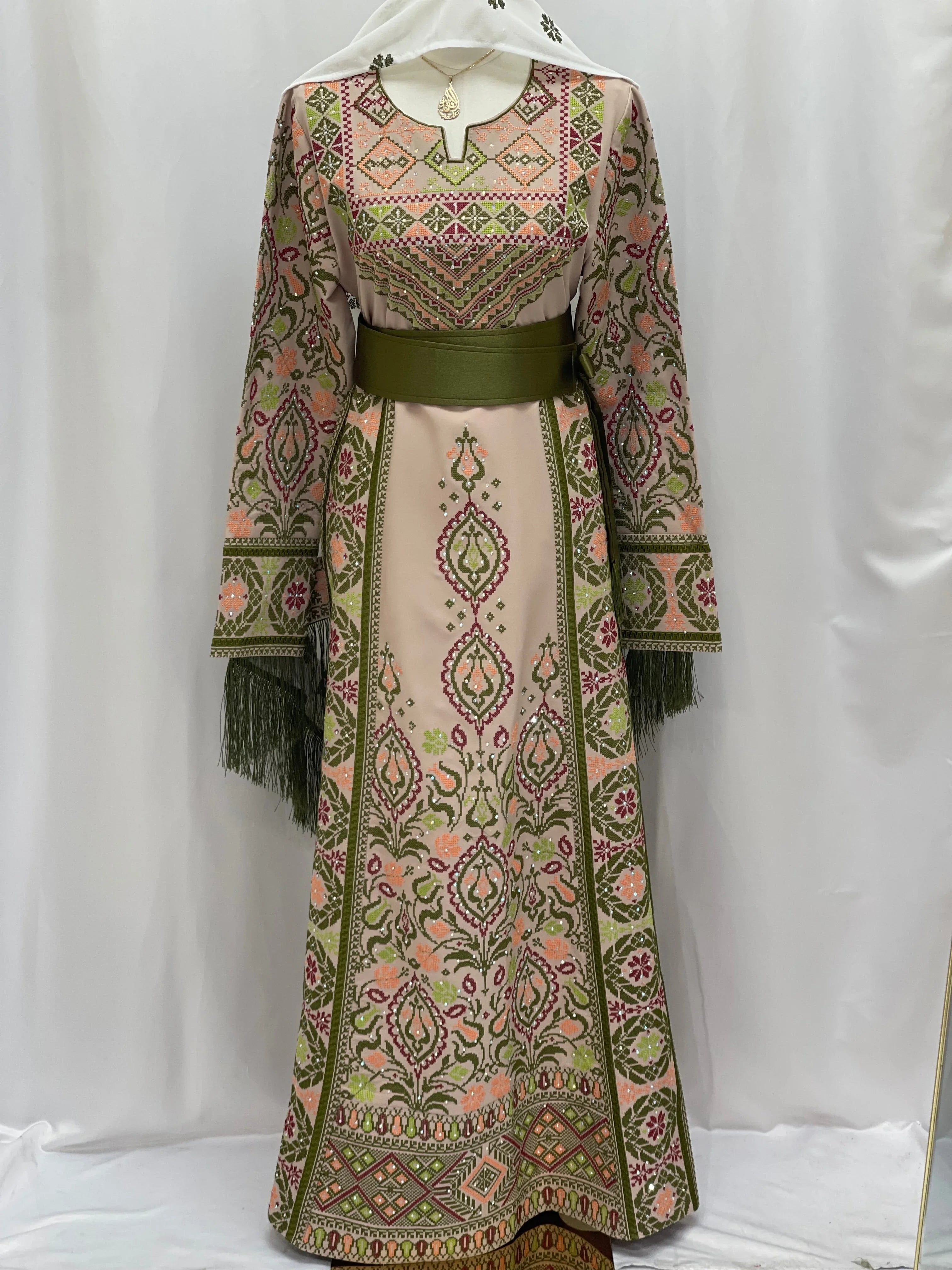 Green Ruby Embroidered Thobe featuring intricate floral designs and a comfortable belt