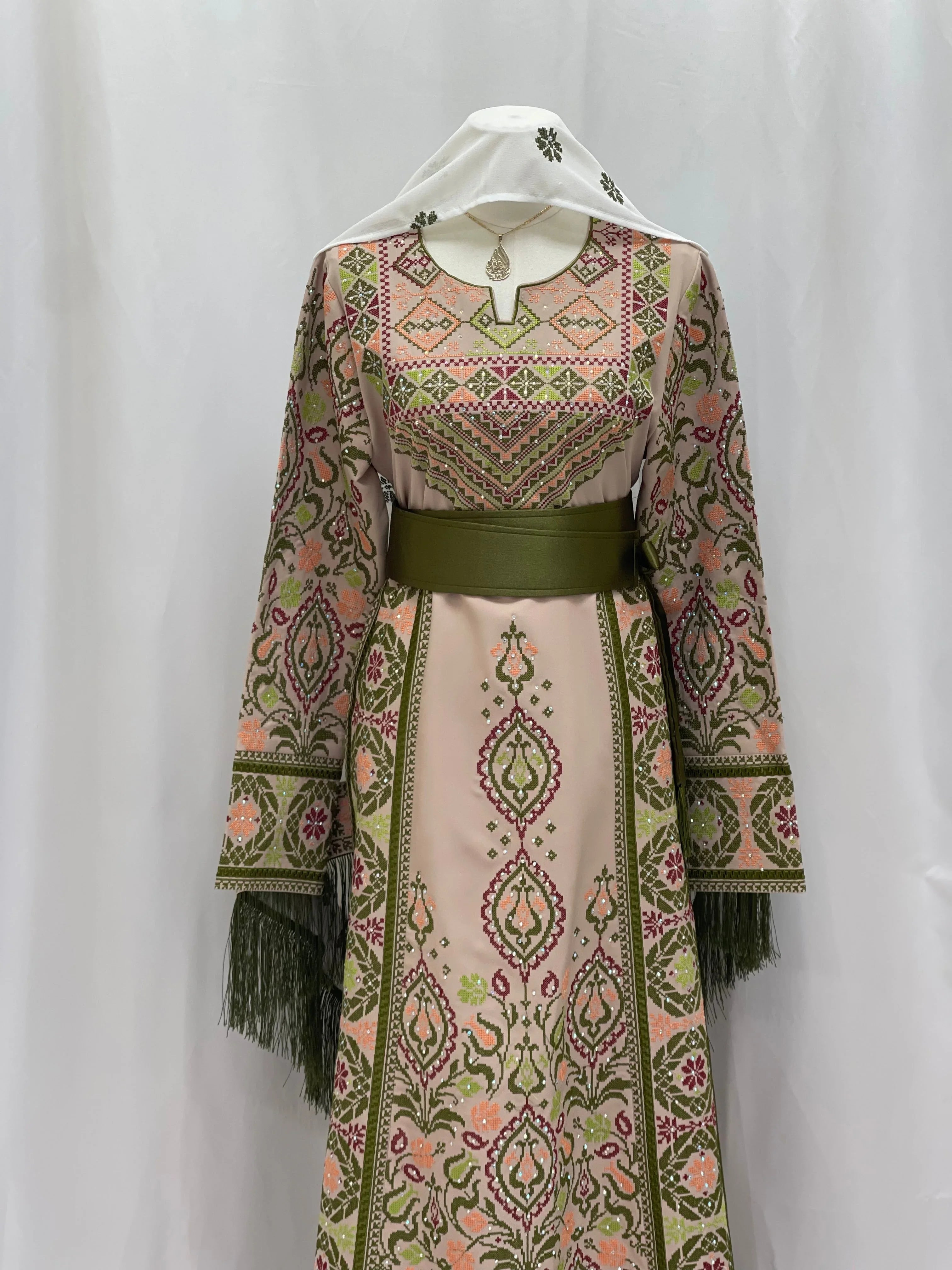 Elegant Green Ruby Embroidered Thobe with intricate patterns and stylish fringe details