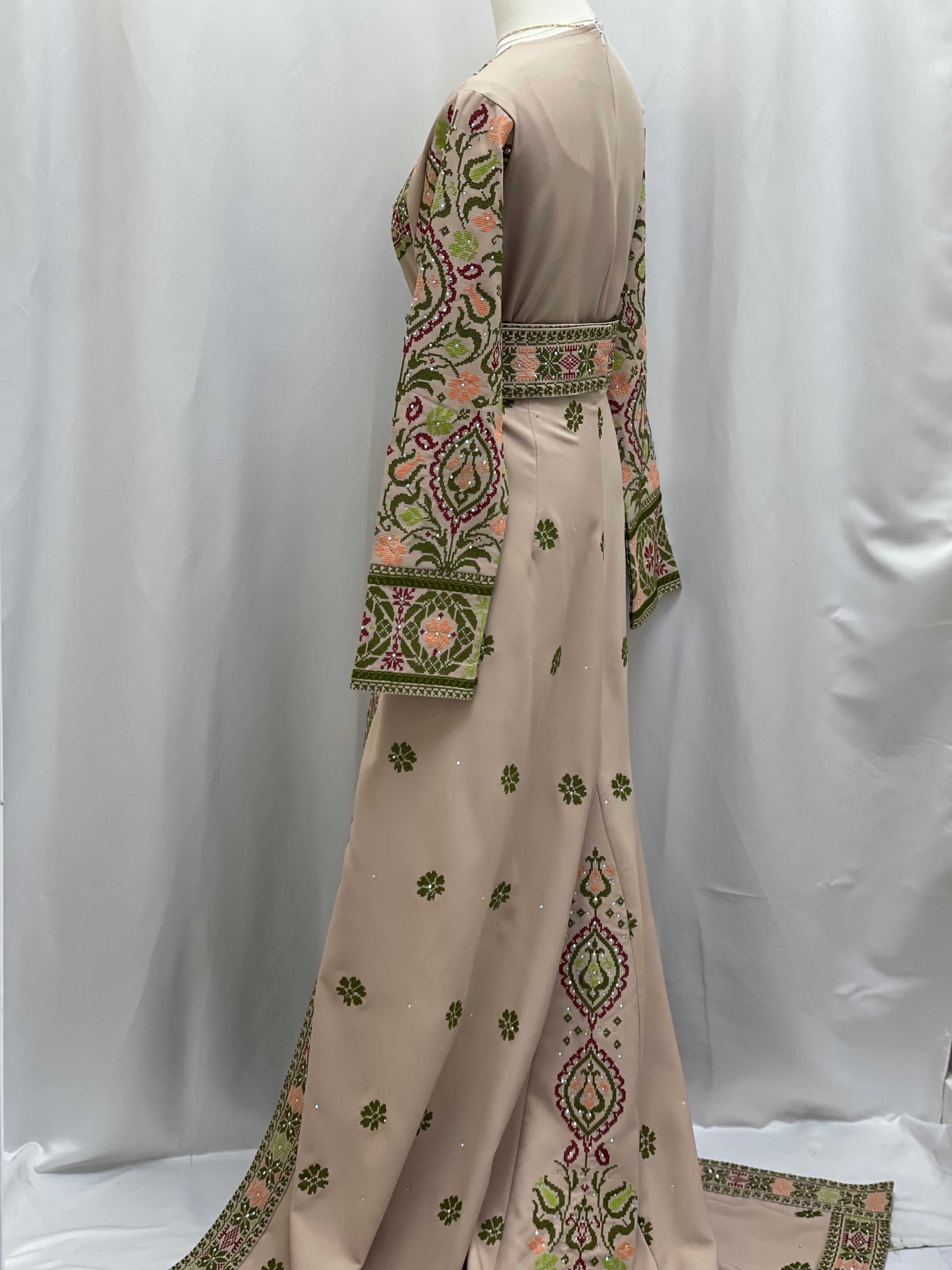 Green Ruby Embroidered Thobe showcasing intricate embroidery and elegant design from Palestinian Elegance