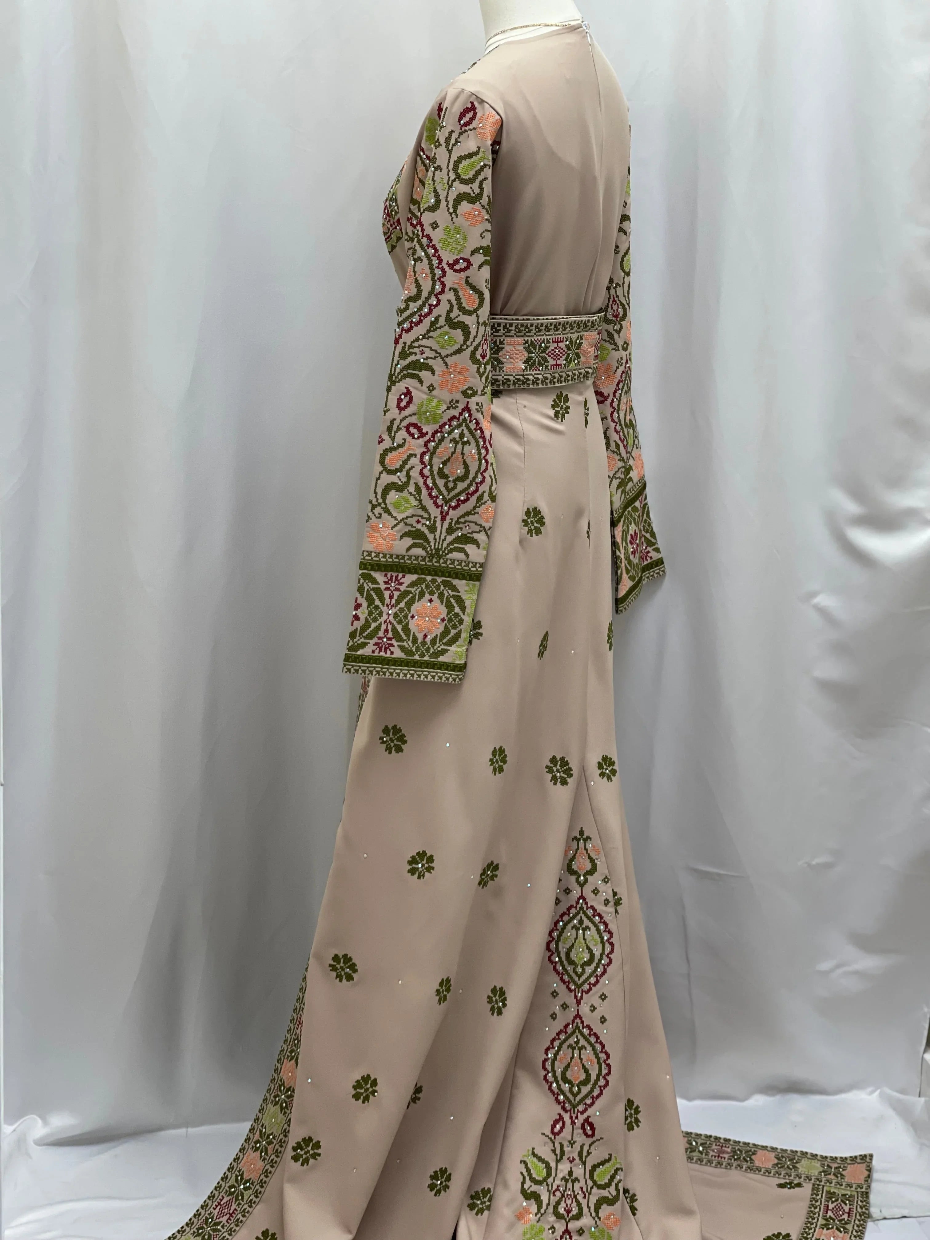 Green Ruby Embroidered Thobe showcasing intricate embroidery and elegant design from Palestinian Elegance
