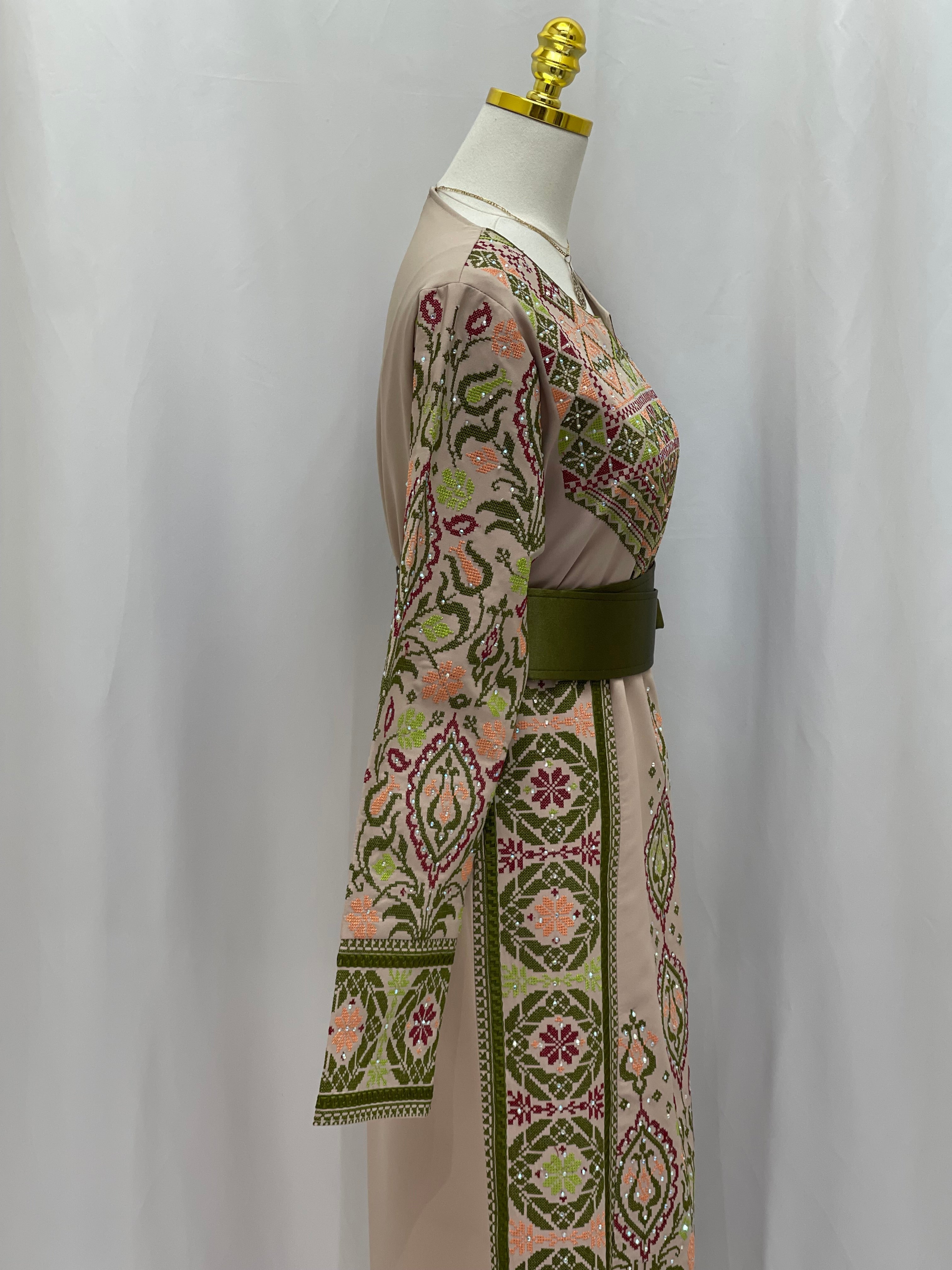 Side view of Green Ruby Embroidered Thobe featuring vibrant floral patterns and long sleeves