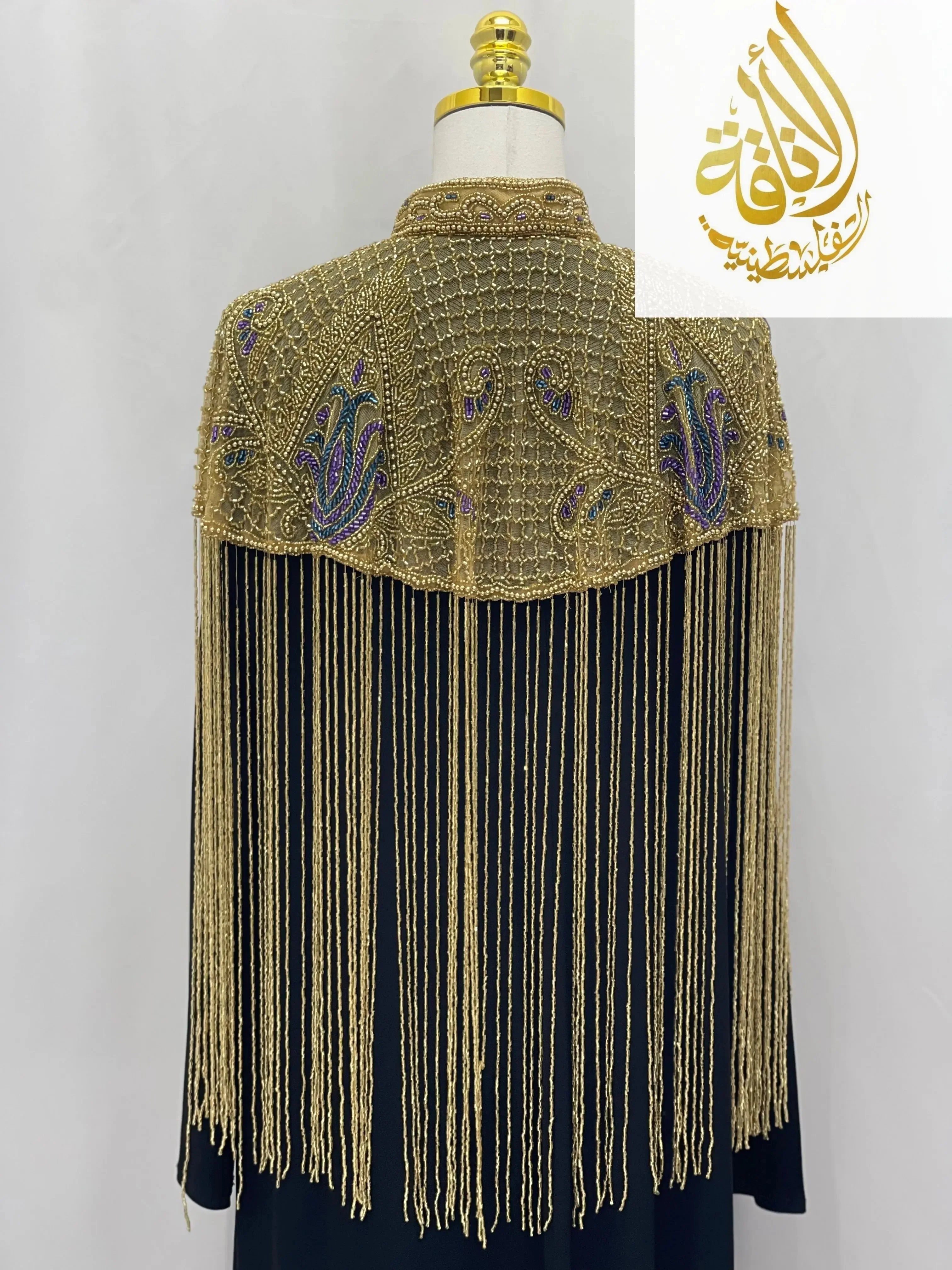 Palestinian Elegance handmade beaded cape with gold and purple beadwork and long fringe detailing