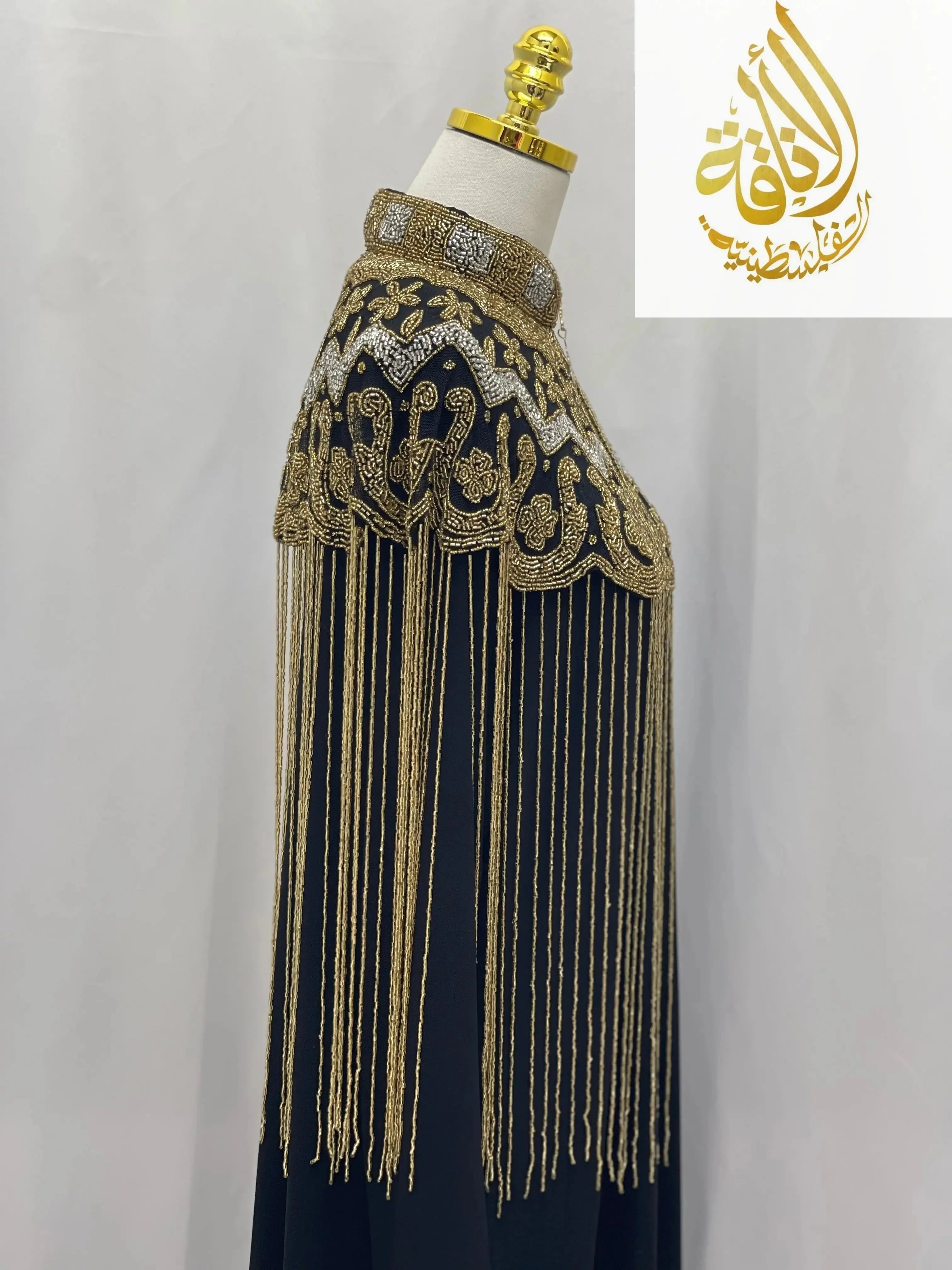Palestinian Elegance handmade beaded cape in gold with intricate embroidery and long fringe detailing