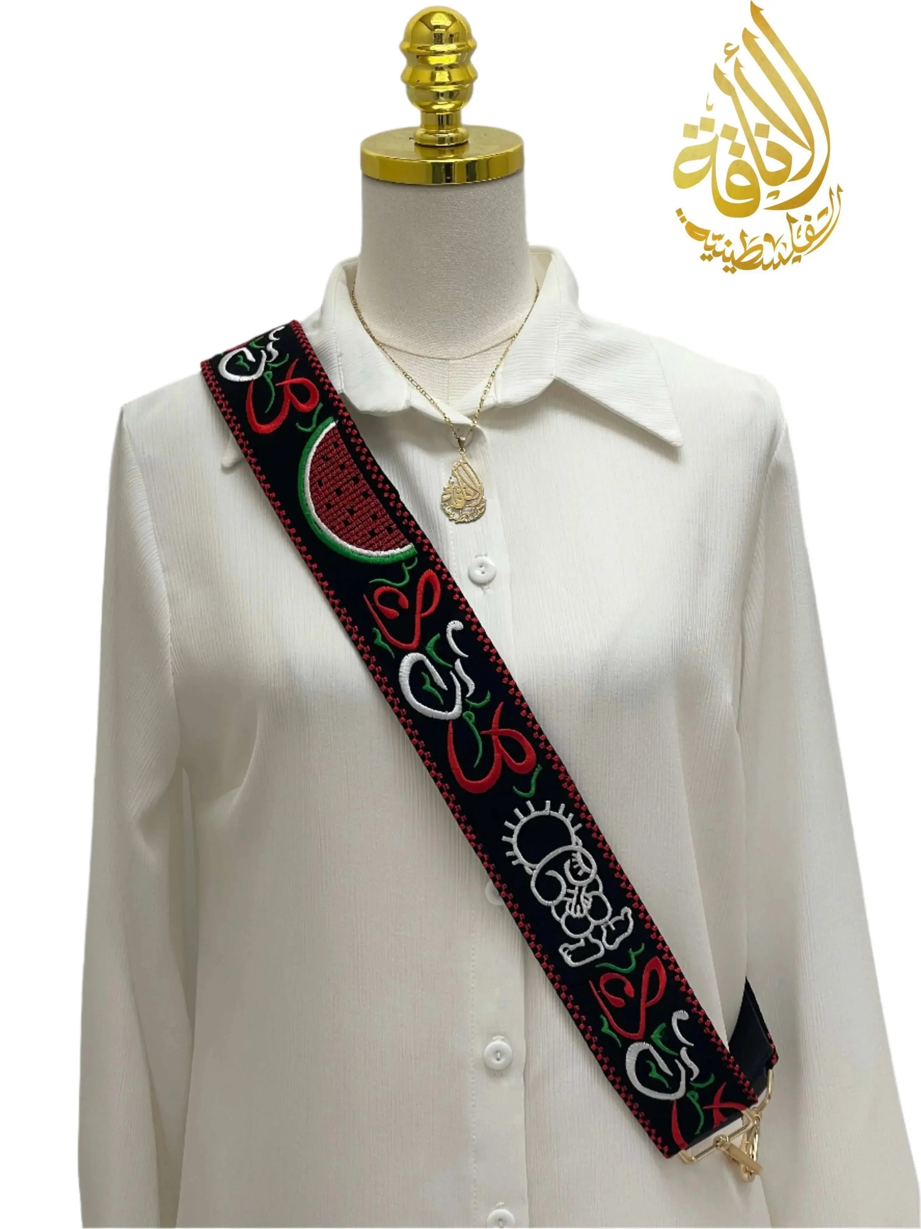 Palestinian Elegance black bag strap with colorful traditional embroidery worn over white shirt Palestinian embroidered purse strap