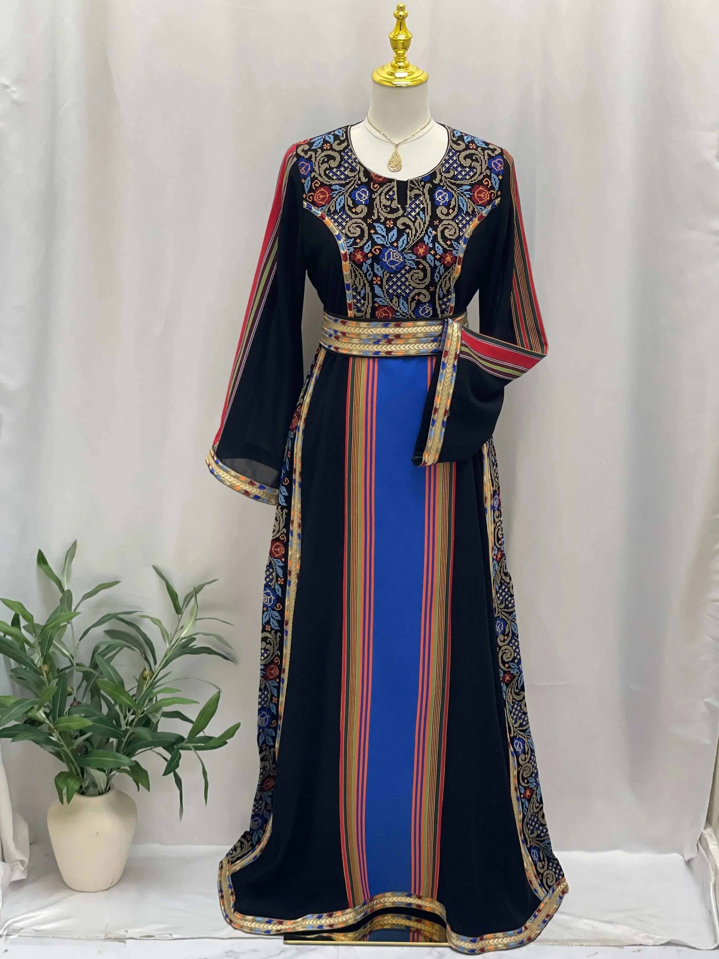 Palestinian Elegance Haya Embroidered Majdalawe Dress with intricate floral embroidery and striped patterns on black fabric