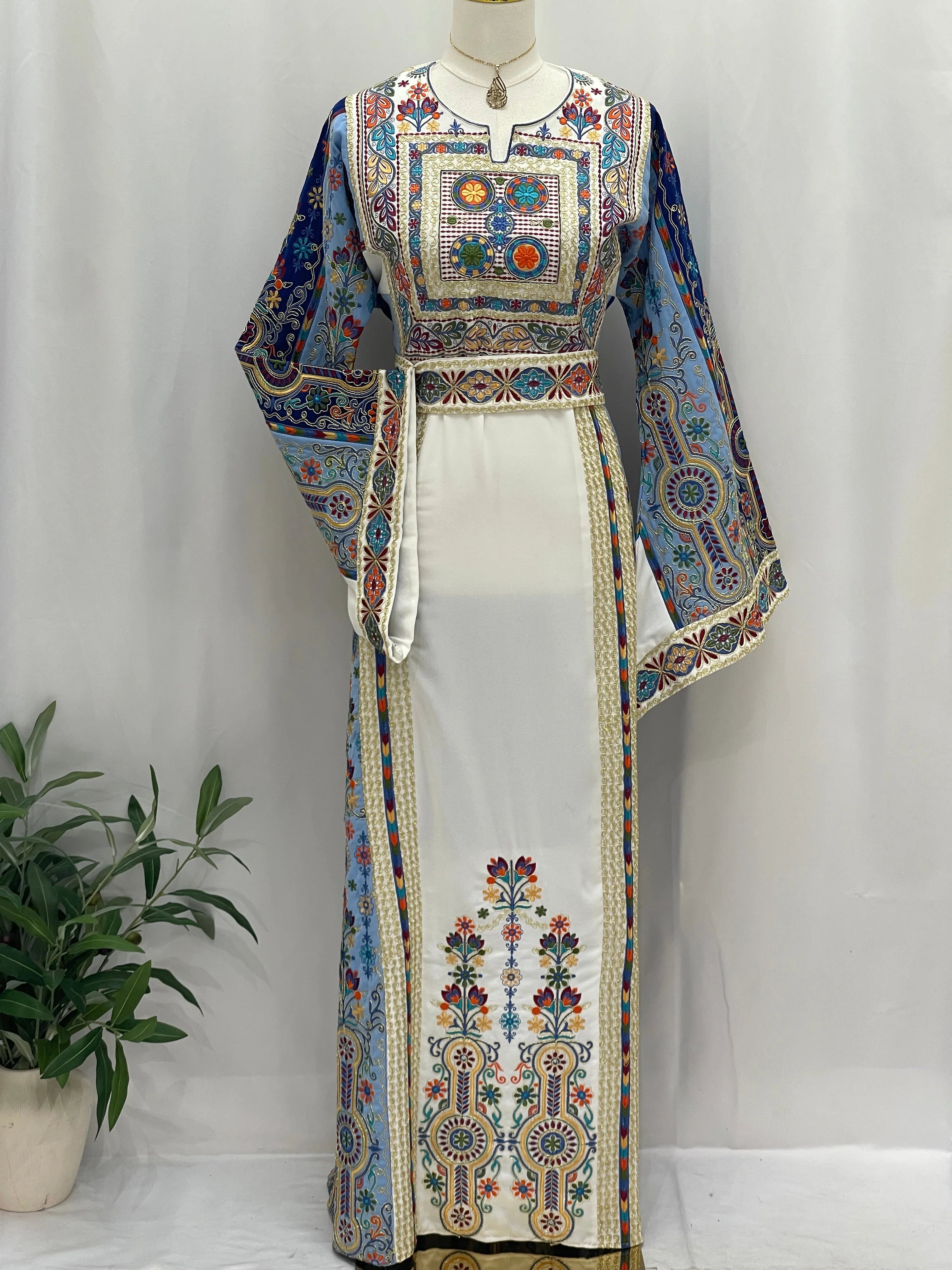 Heavenly Blossoms Thobe embroidered Palestinian Elegance long white gown with blue floral panels and belt