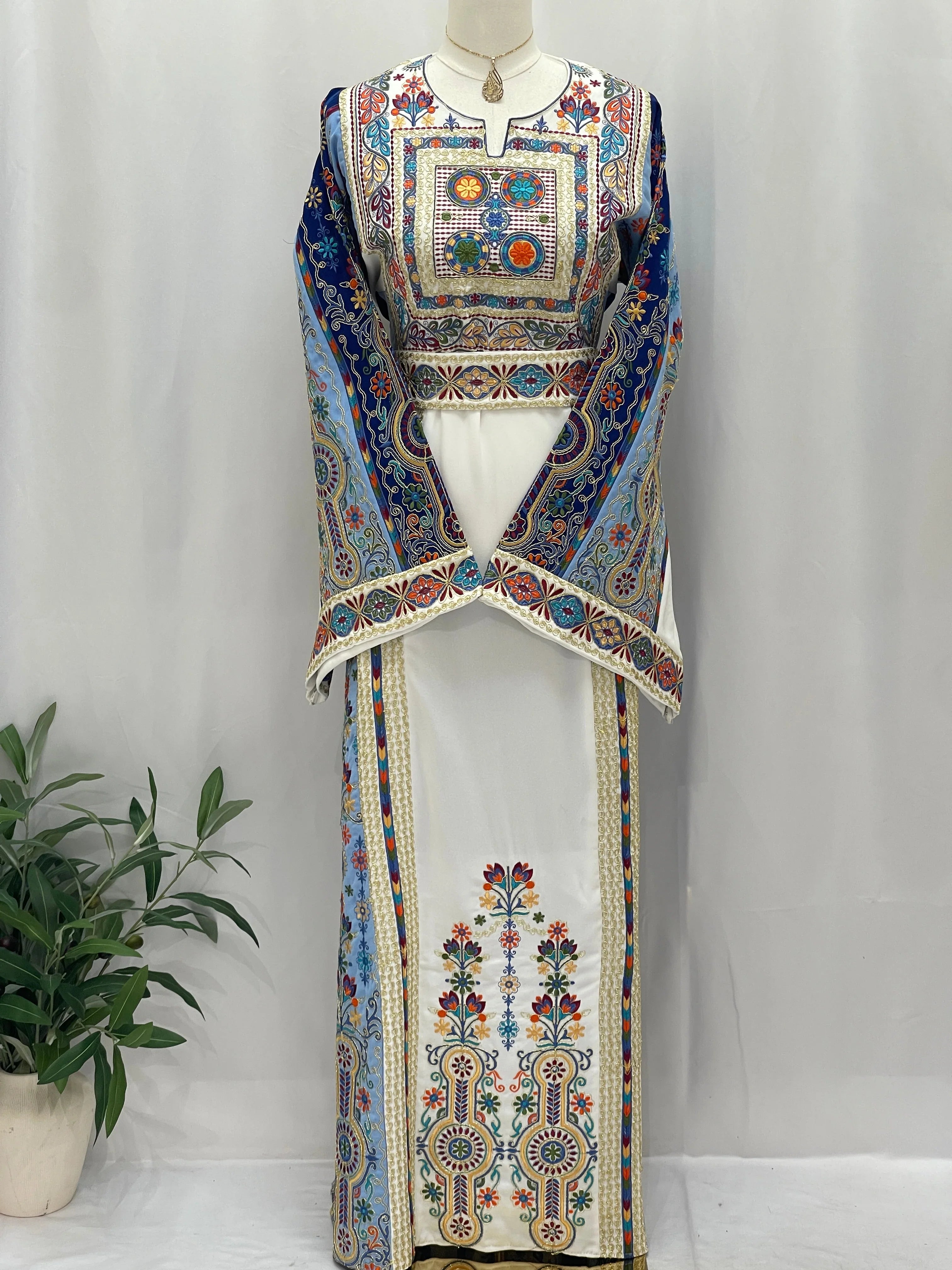 Palestinian Elegance Heavenly Blossoms Thobe embroidered white traditional dress with colorful floral panels