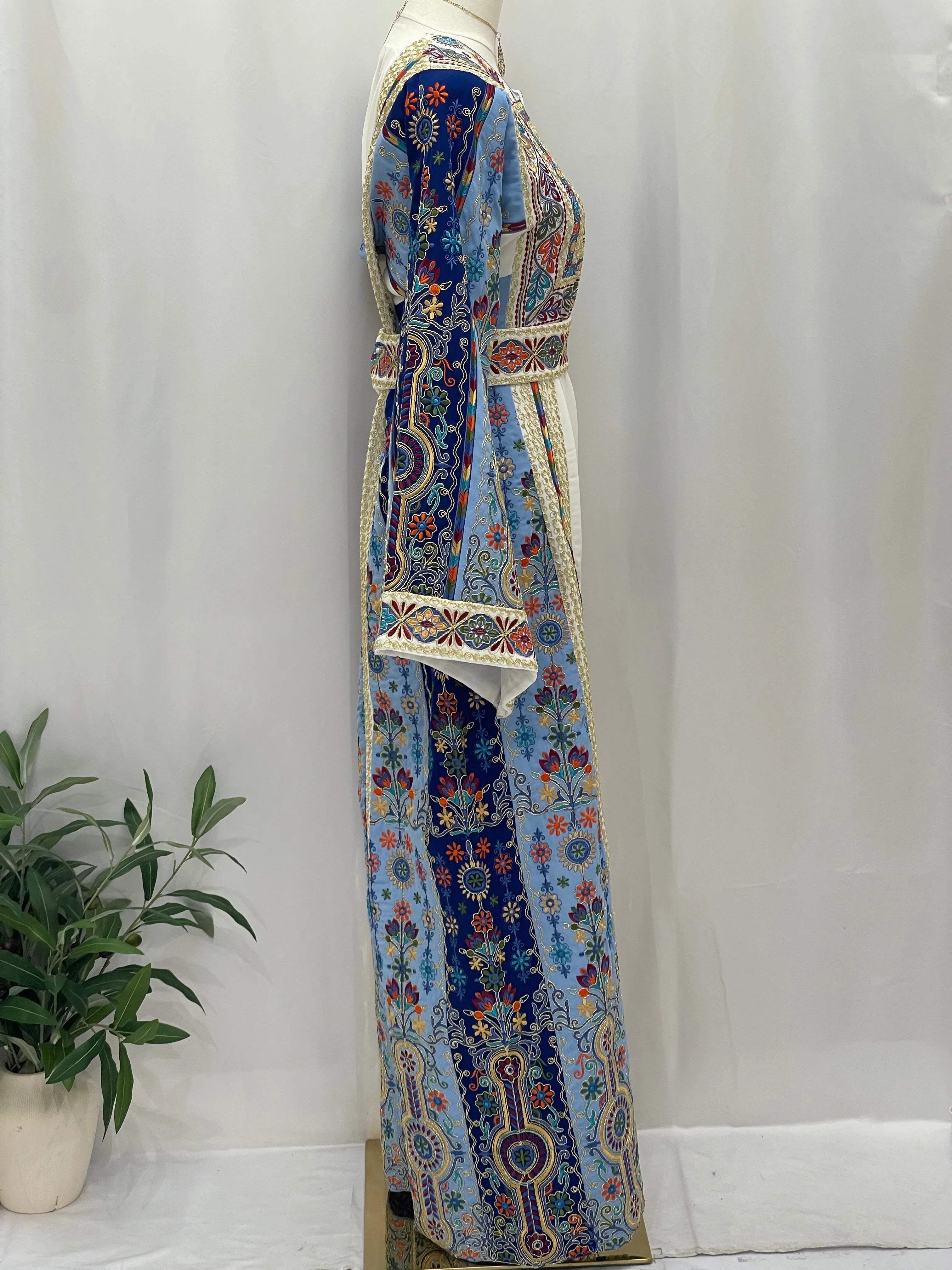 Heavenly Blossoms Thobe by Palestinian Elegance side view embroidered blue floral floor length thobe