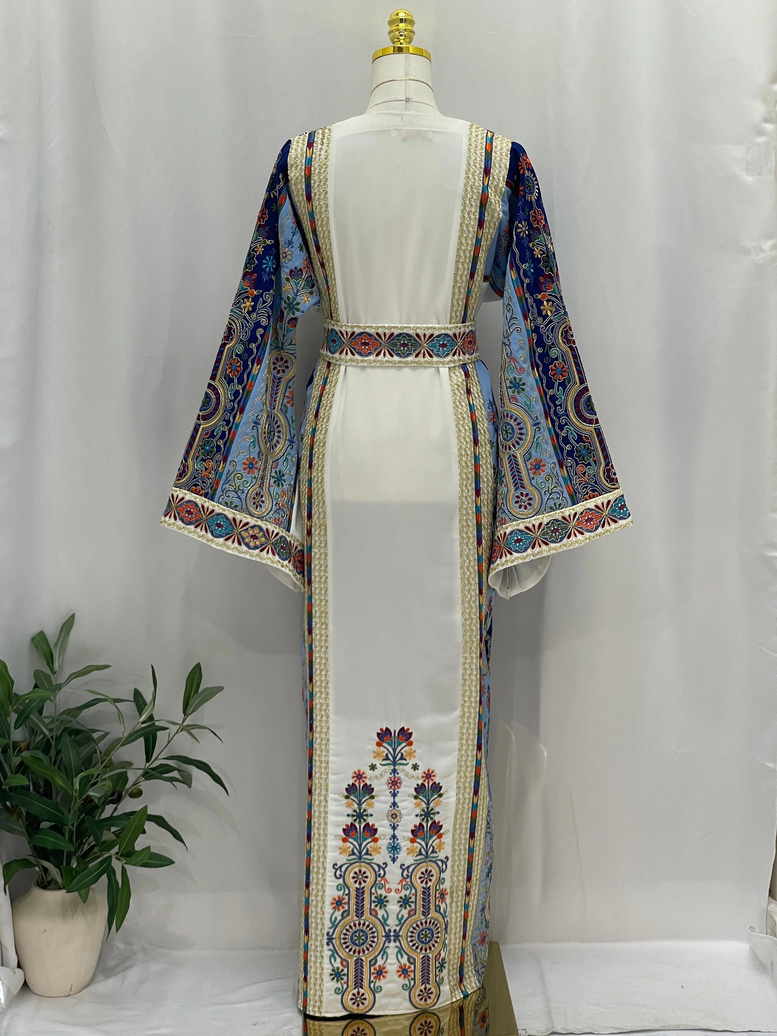 Palestinian Elegance Heavenly Blossoms Thobe white embroidered thobe with colorful floral sleeves and back panel