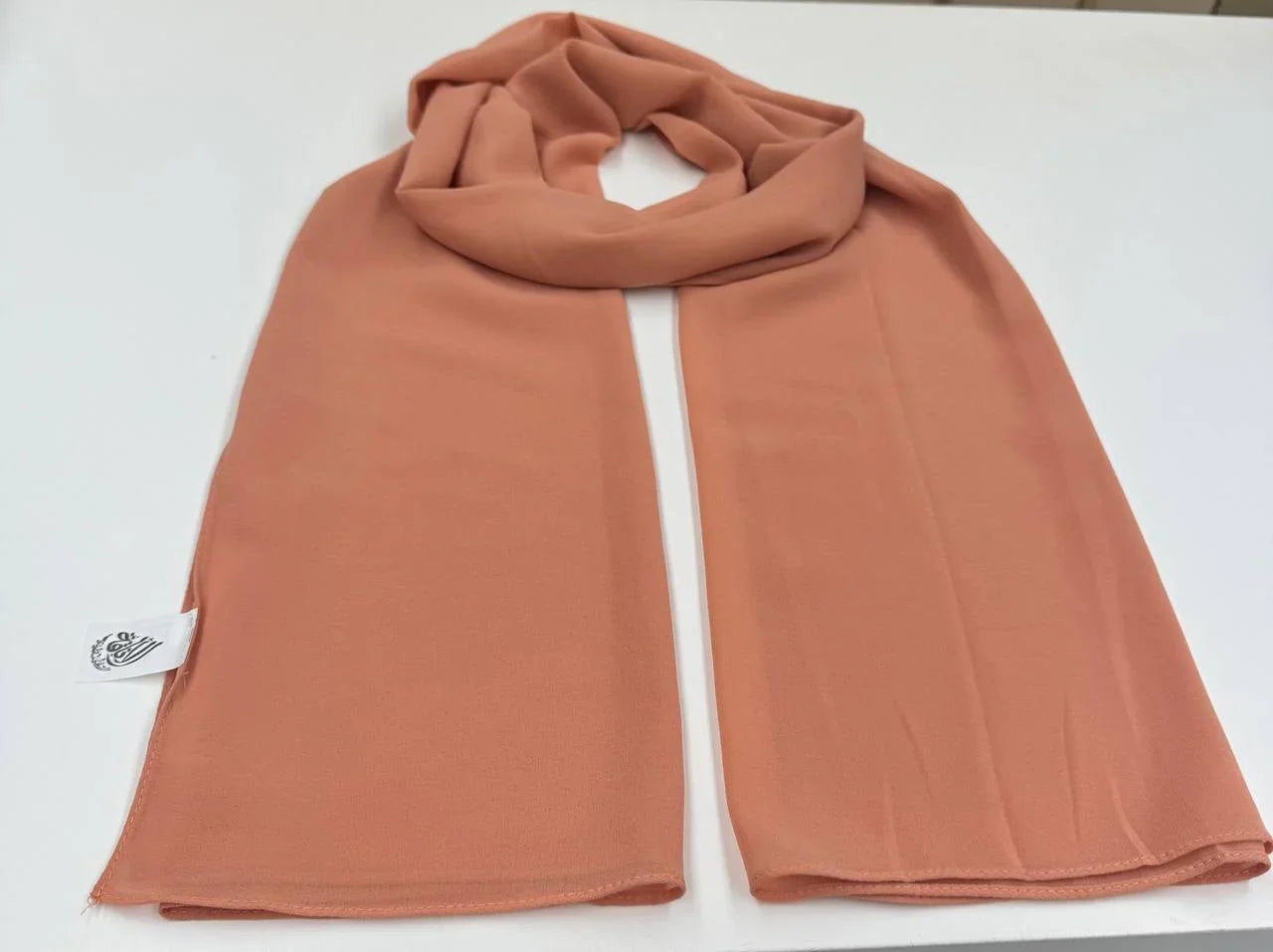 High Quality Chiffon Hijab in soft peach color, perfect for stylish and elegant outfits