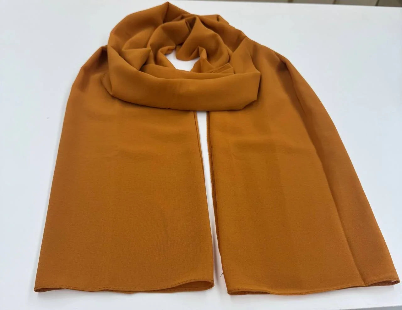 High Quality Chiffon Hijab in warm orange color, perfect for stylish and elegant looks