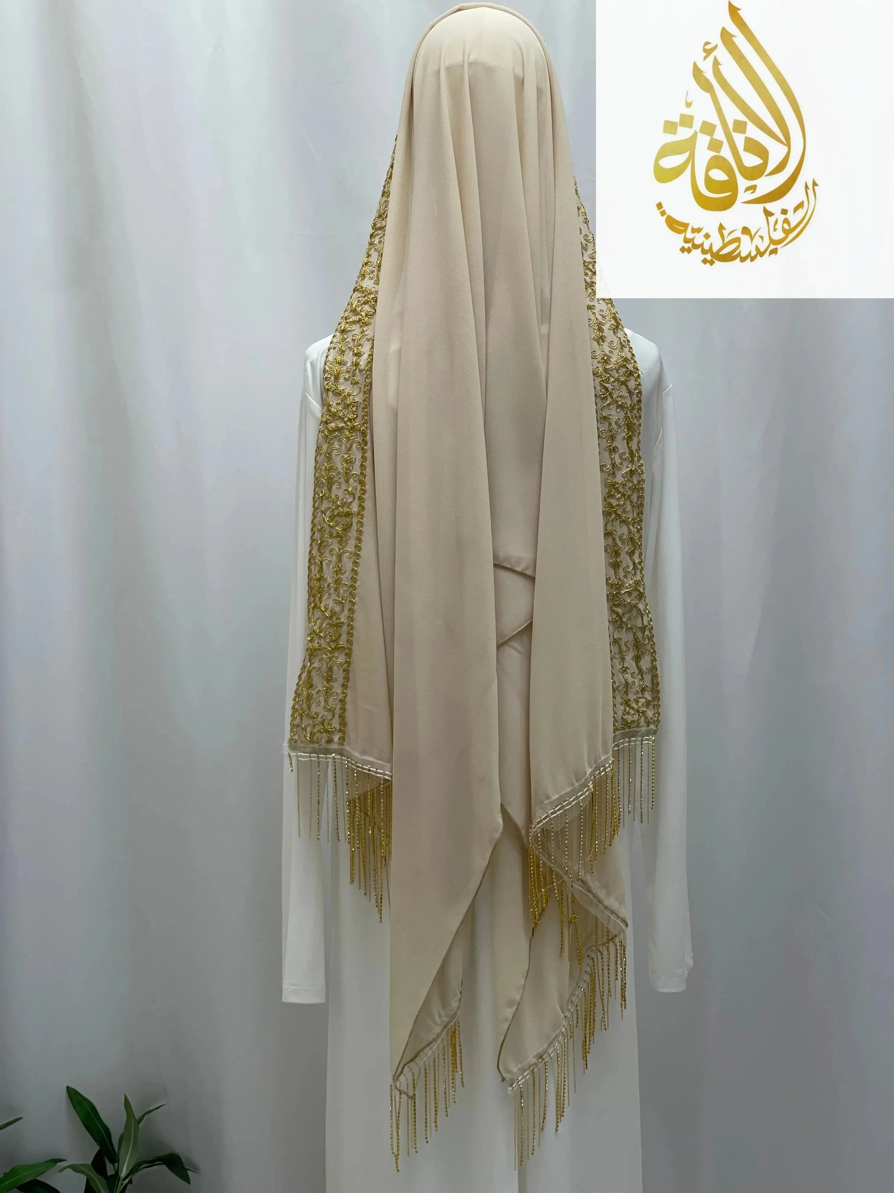 Palestinian Traditional Modest Fashion Kasab Khirka embroidery with gold thread on beige fabric by Palestinian Elegance