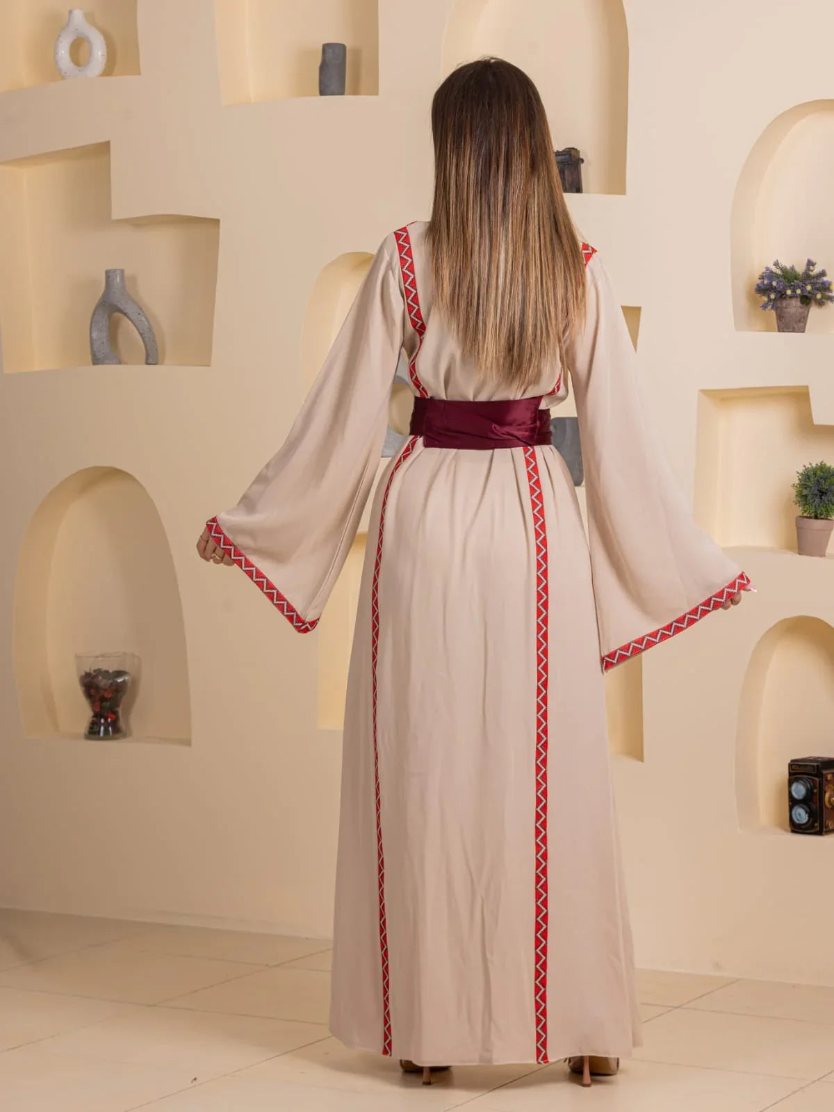 Palestinian Elegance Huda Simply Embroidered Thoub. Back view cream thobe with red embroidery and maroon waist sash