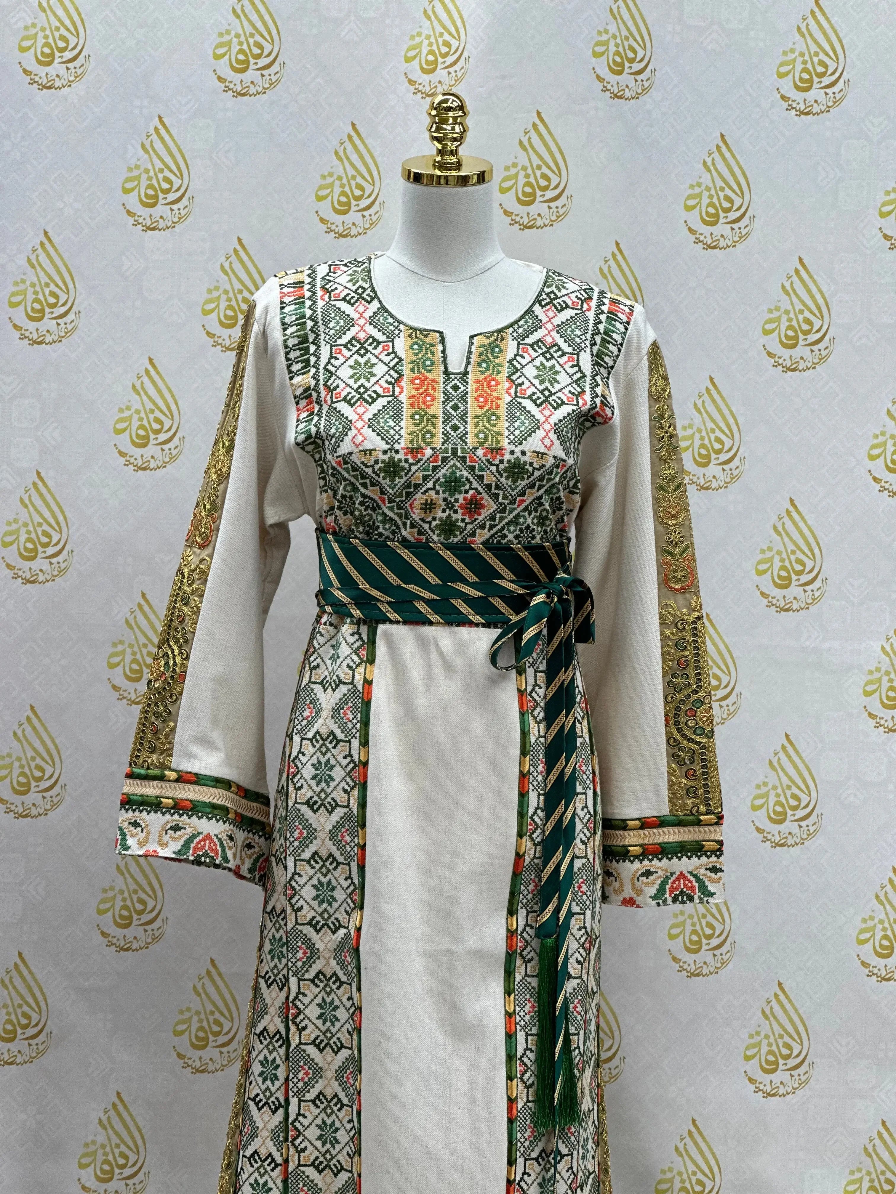 Embroidered Palestinian thobe with intricate floral and geometric designs and a striped belt from Palestinian Elegance